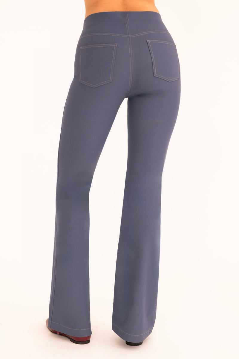 Blue flared pants on a white background