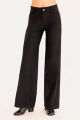 Black wide-leg pants worn by a person on a white background