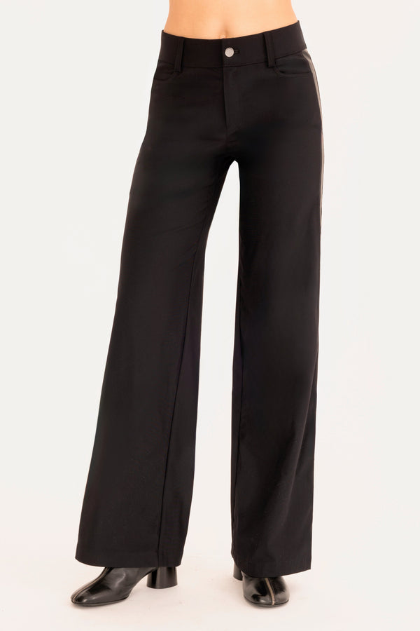 Black wide-leg pants worn by a person on a white background