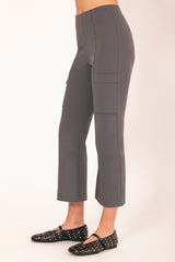 Person wearing gray cargo pants on a white background