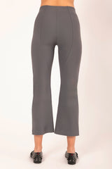 Gray pants worn by a person on a white background