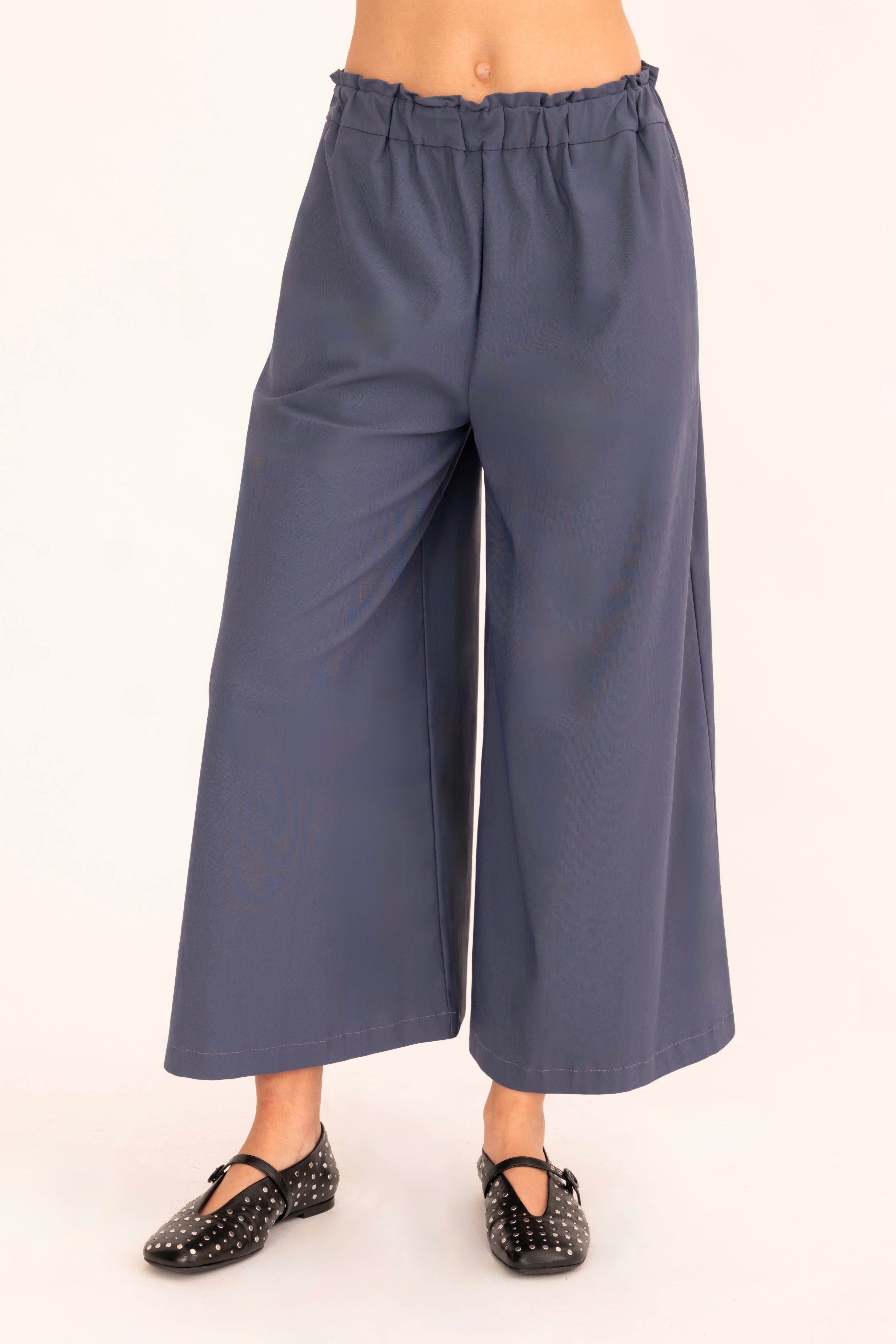 Front view of blue culotte pant on a white background