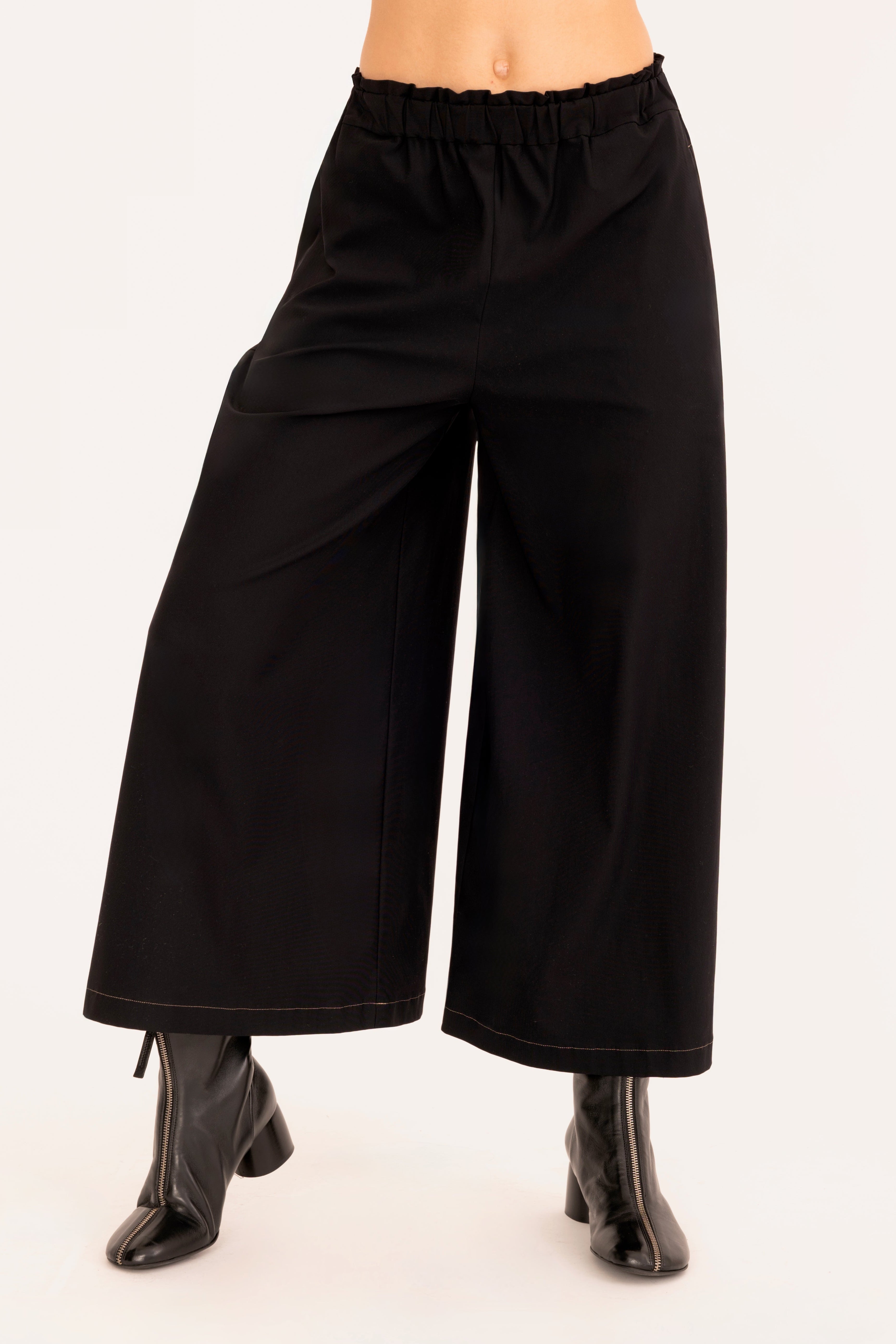 Front view of black culotte pant on a white background