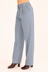 Light blue pants worn by a person on a white background