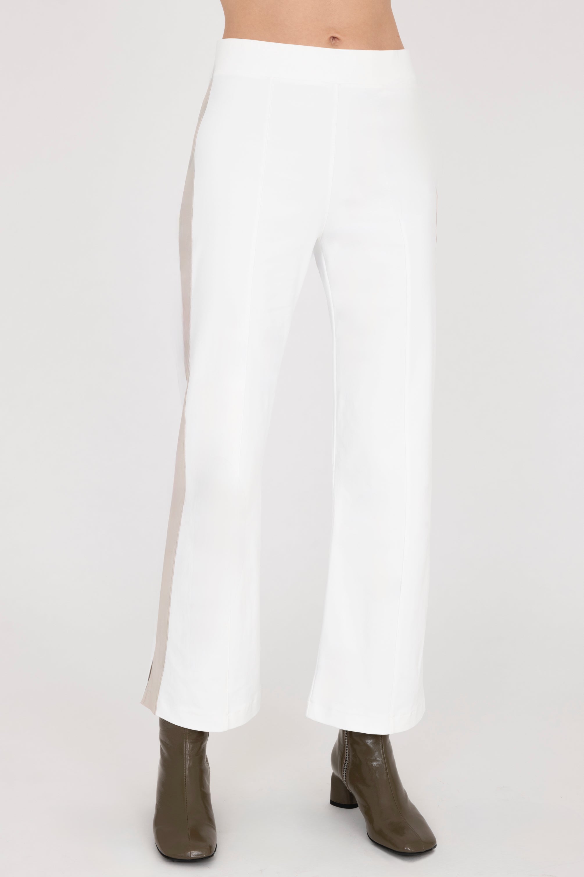Front view of white cropped pants with cream side stripe on a white background