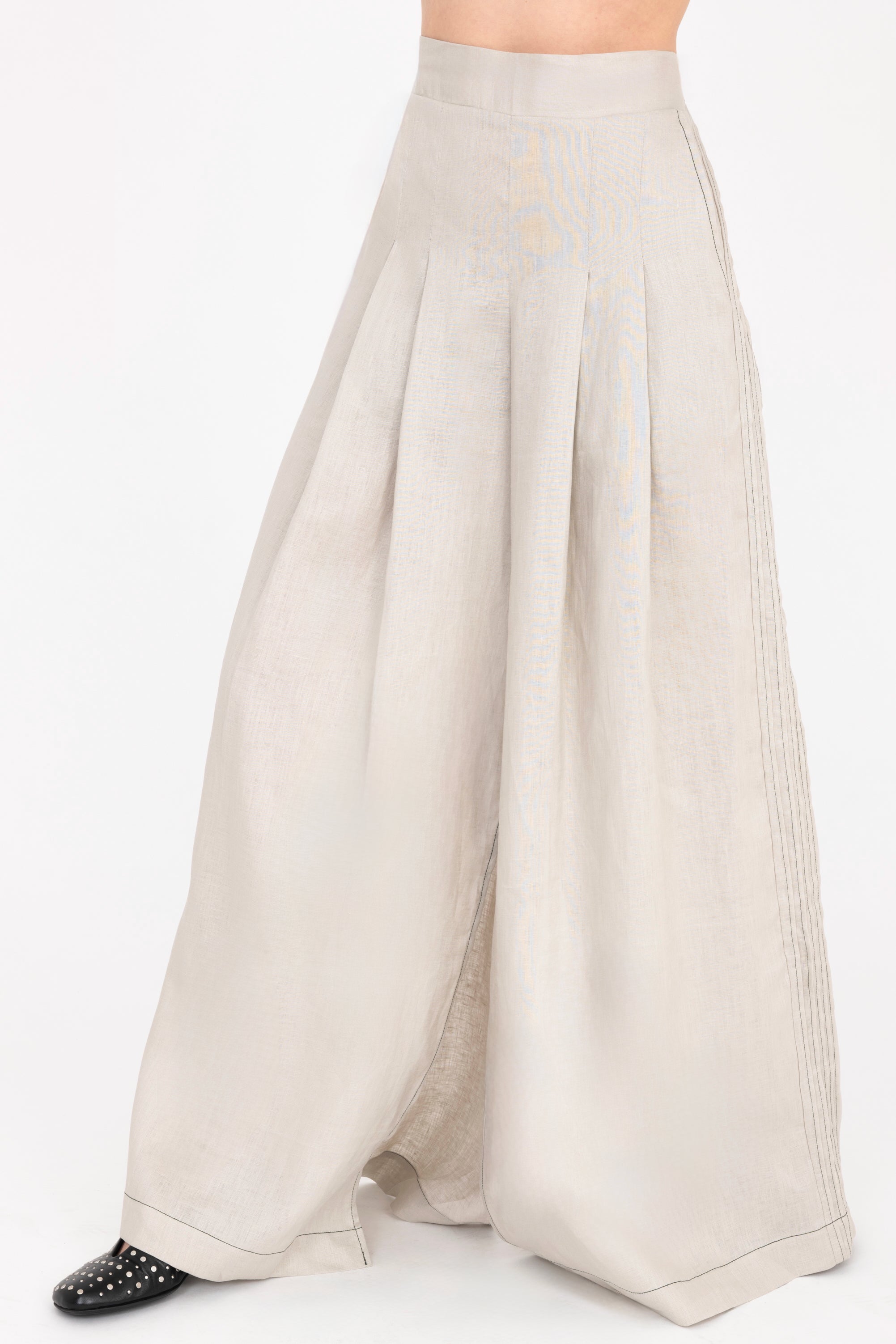Beige wide-leg pants on a white background