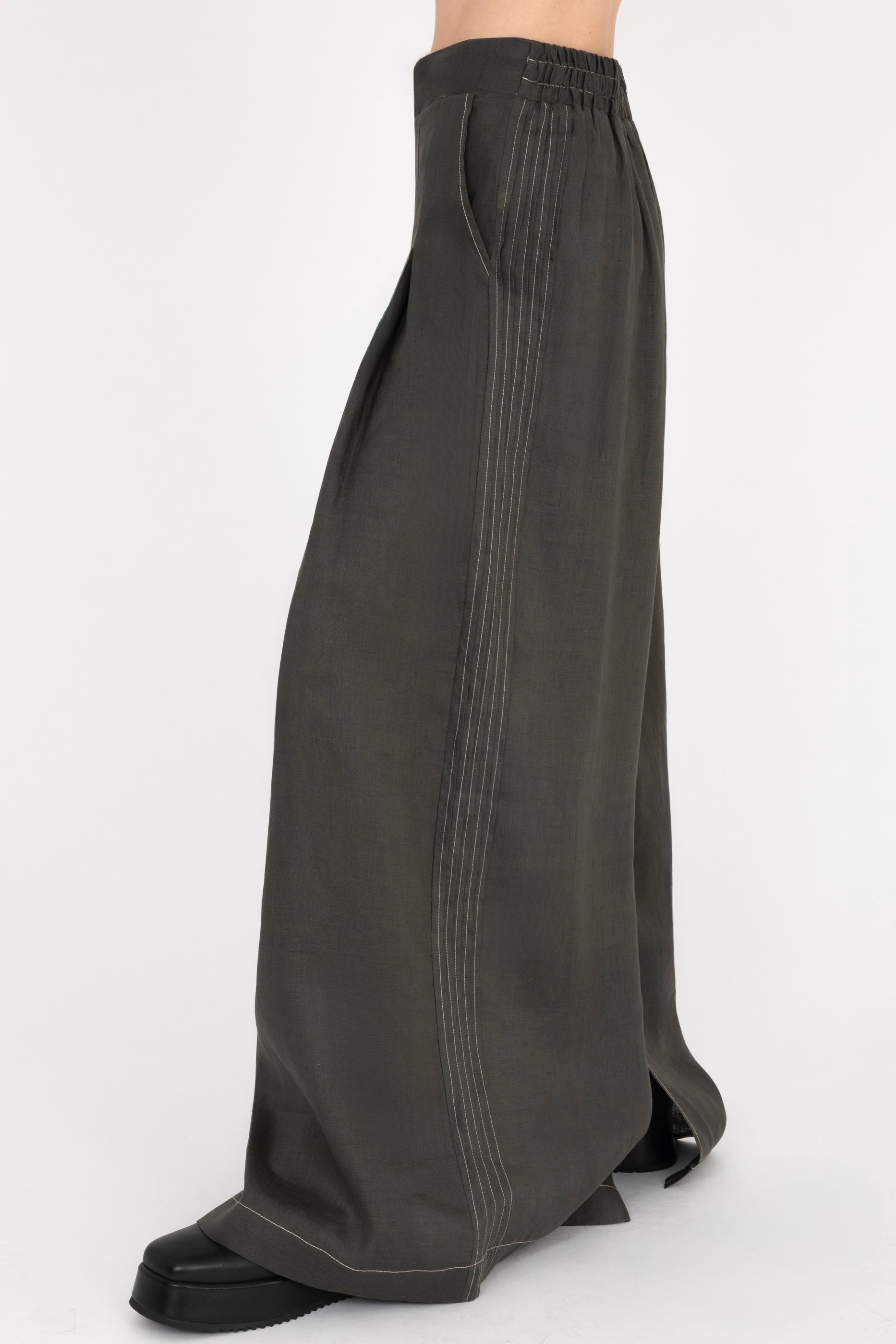 Pine green wide-leg pants on a white background