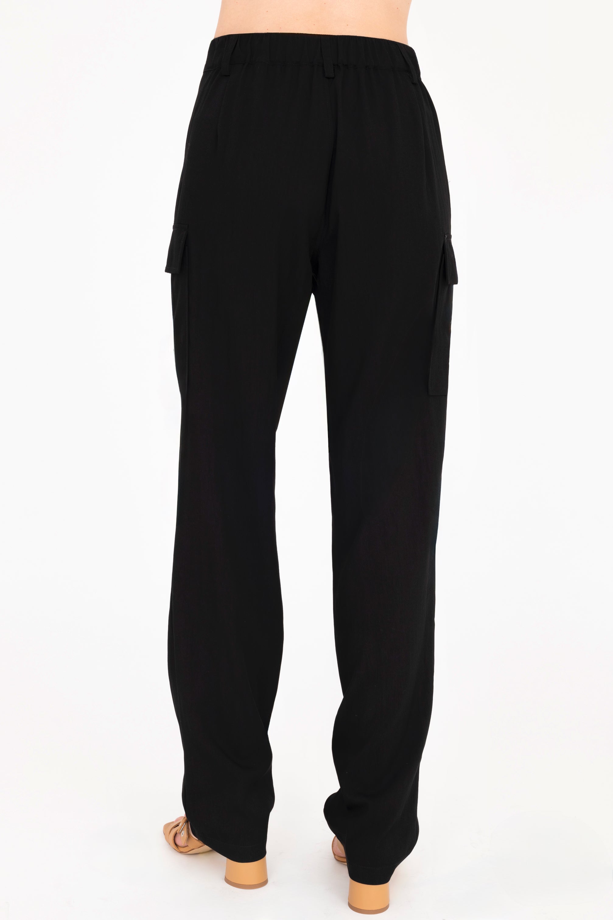 Back view of black cargo pants on a white background