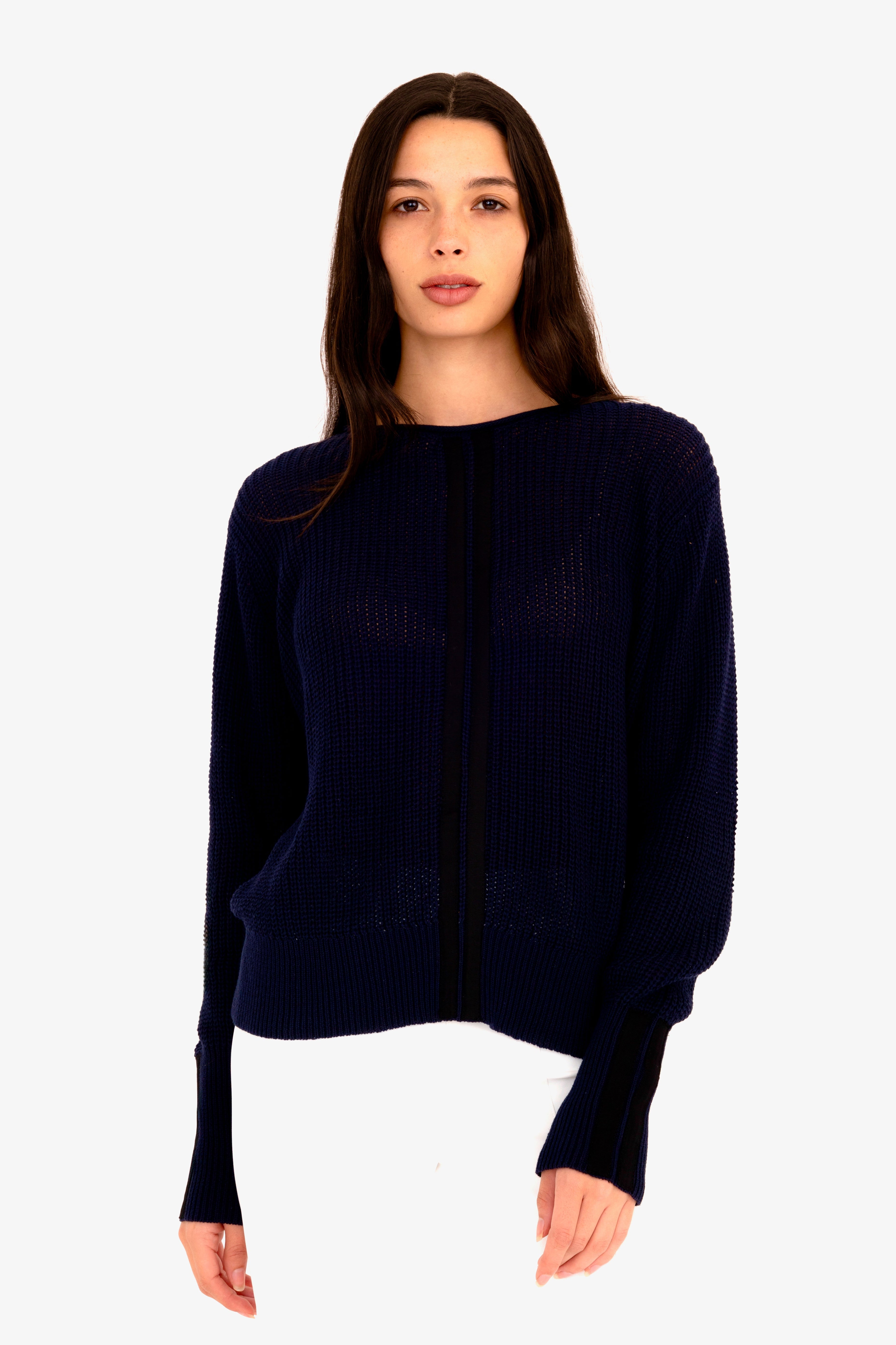 Woman wearing a dark blue sweater on a white background