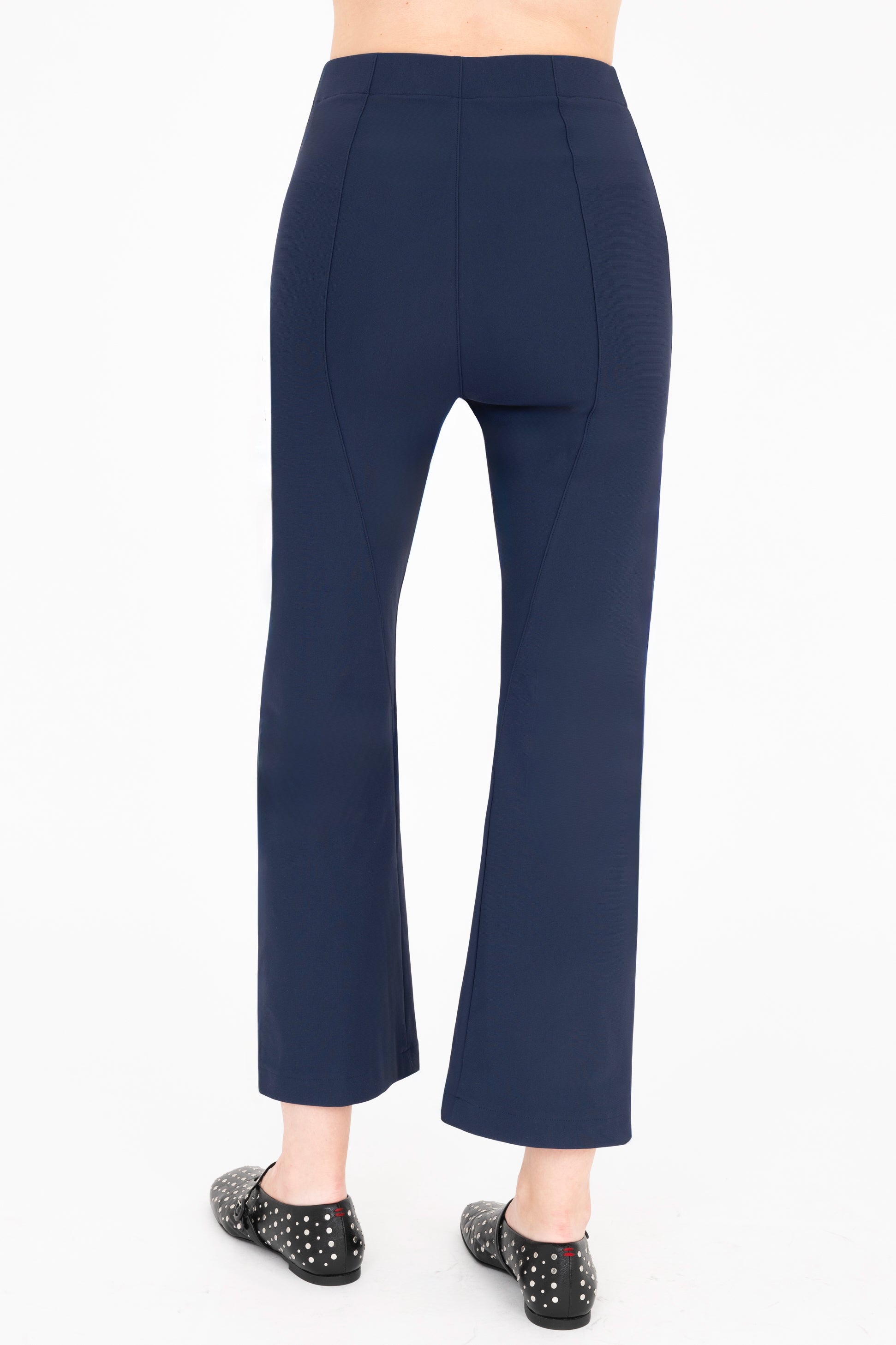 Back view of indigo blue cargo pants on a white background