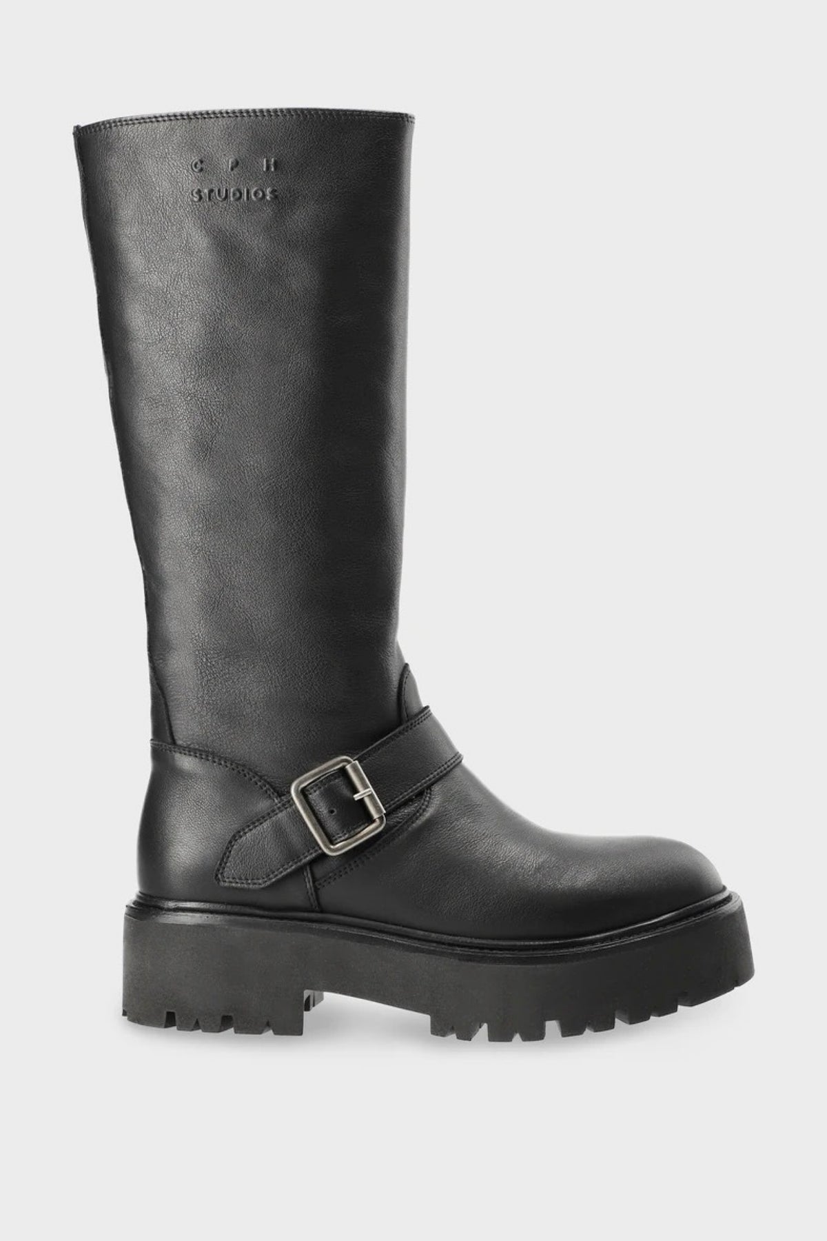 A black leather knee-high boot with a chunky lug sole and a silver buckle strap across the ankle, shown against a light gray background.