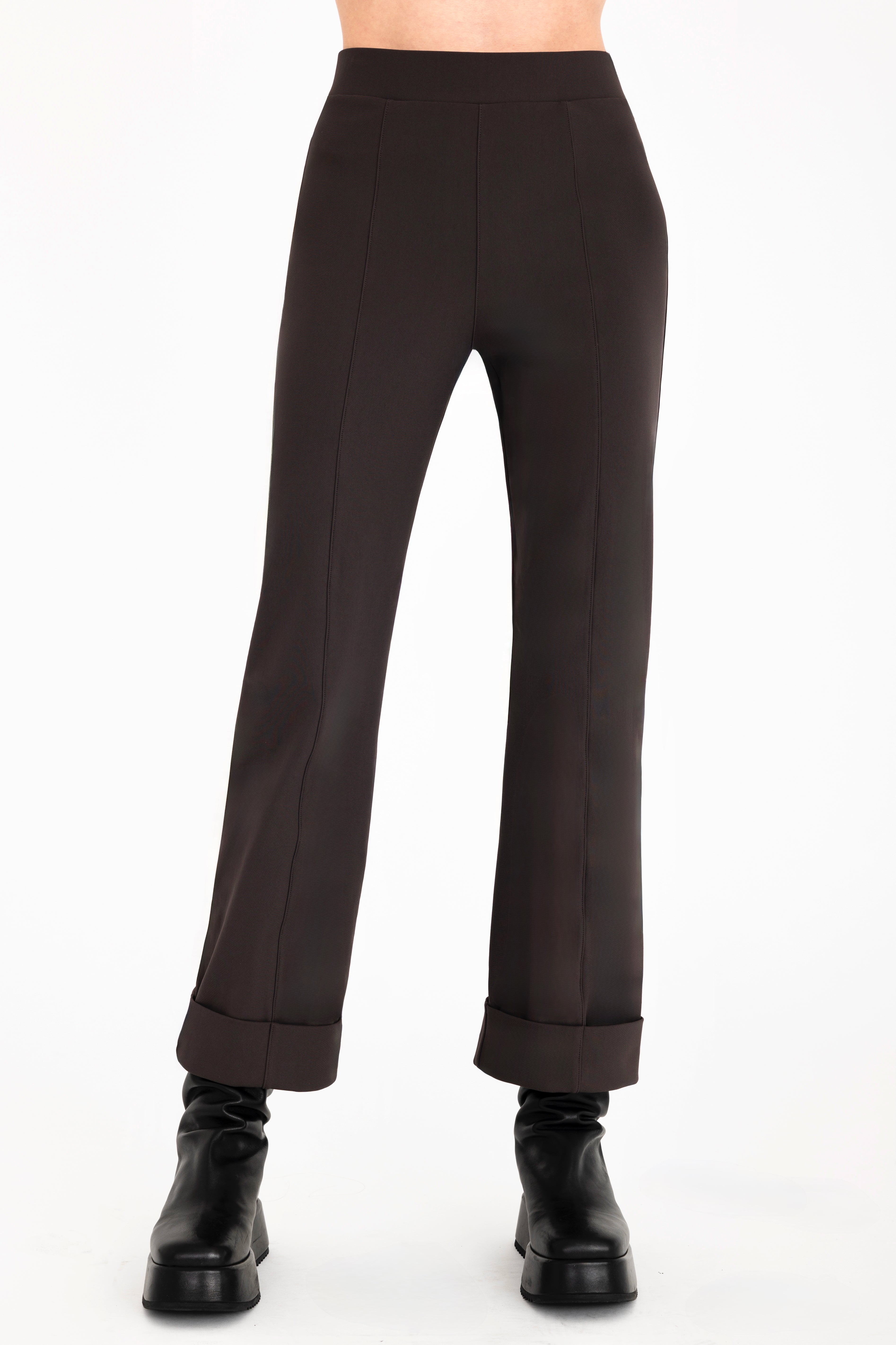 Brown pants worn by a person on a white background