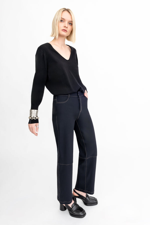 Woman wearing a black outfit on a white background