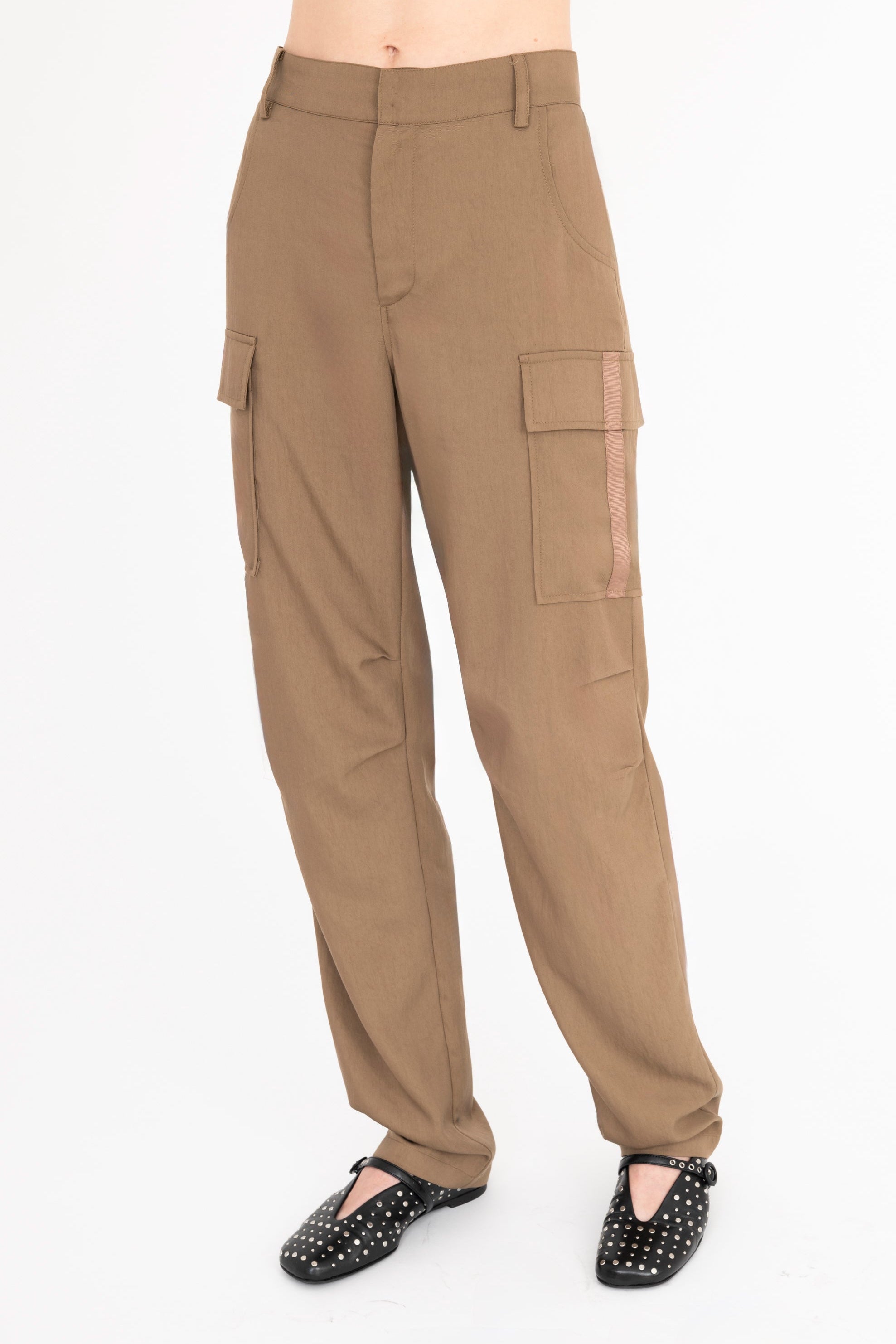 Brown cargo pants worn by a person on a white background