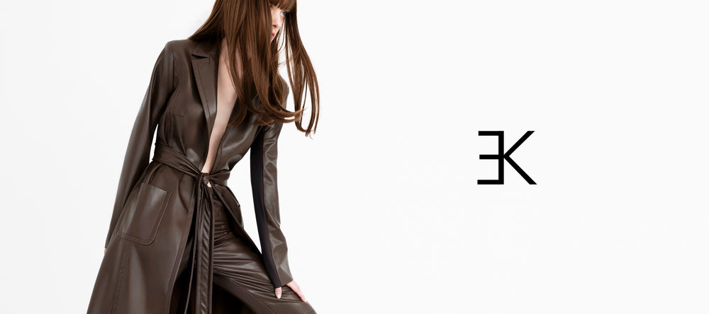 Woman wearing a brown leather outfit with a brand logo on a white background