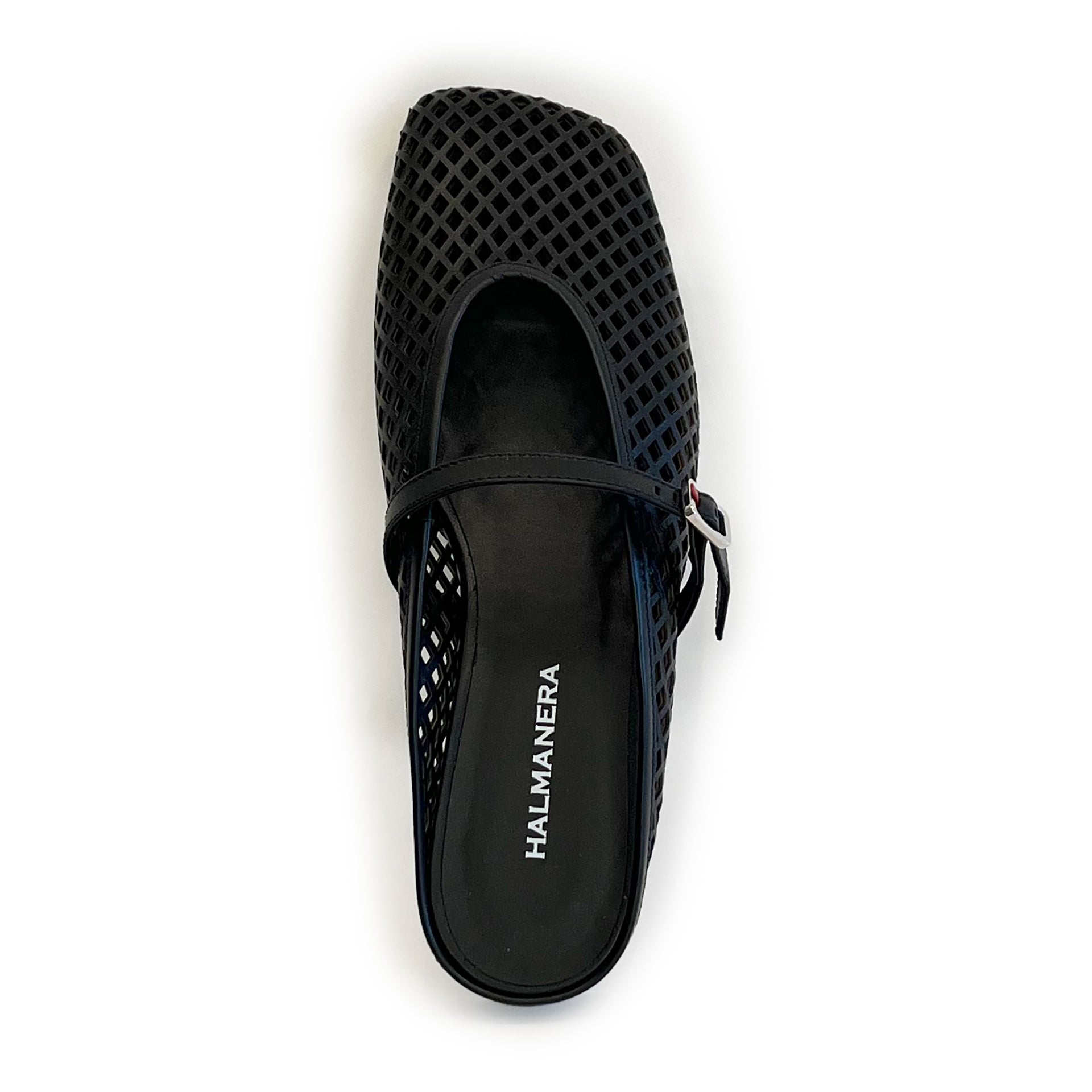 Black laser cut leather strap slip on flat shoe on a white background