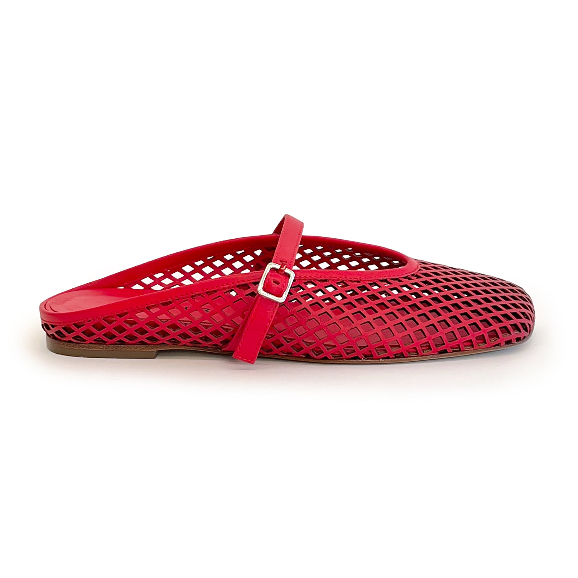 Red laser cut leather strap slip on flat shoe on a white background