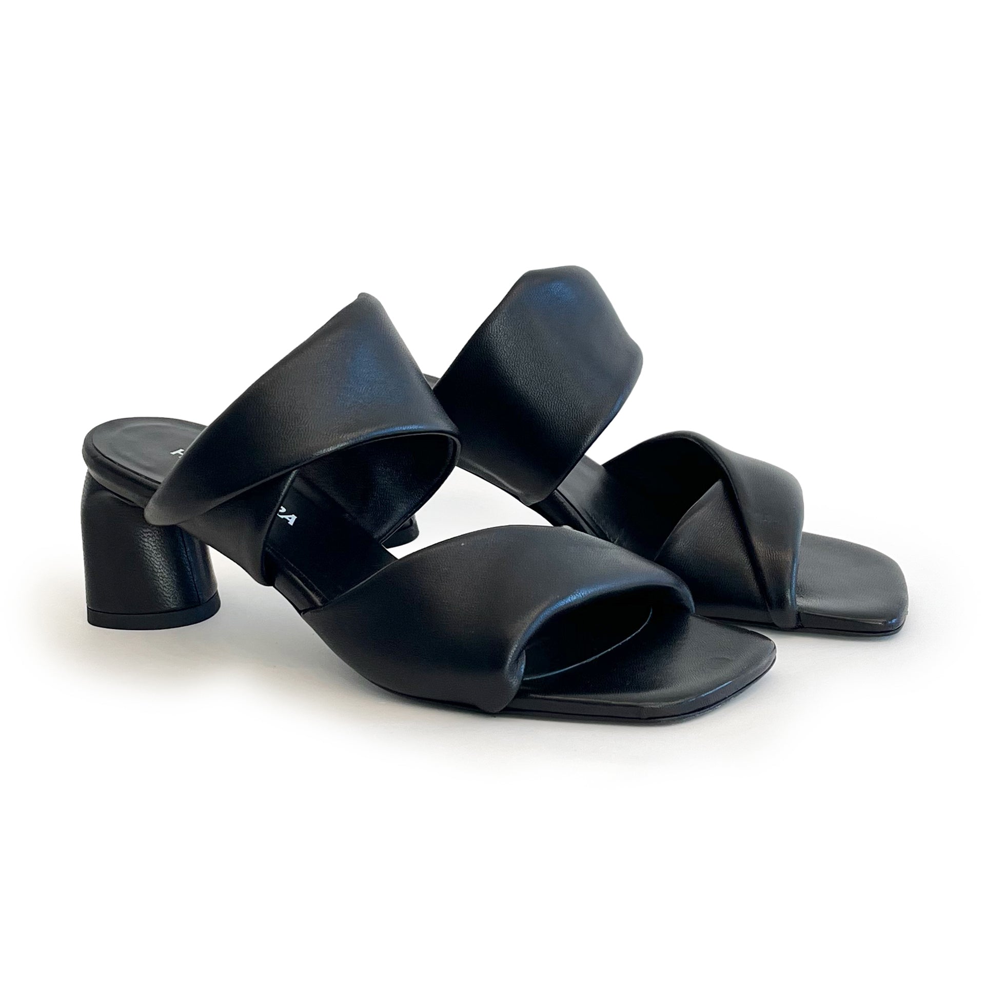 Black sculptured chunky heel sandals on a white background