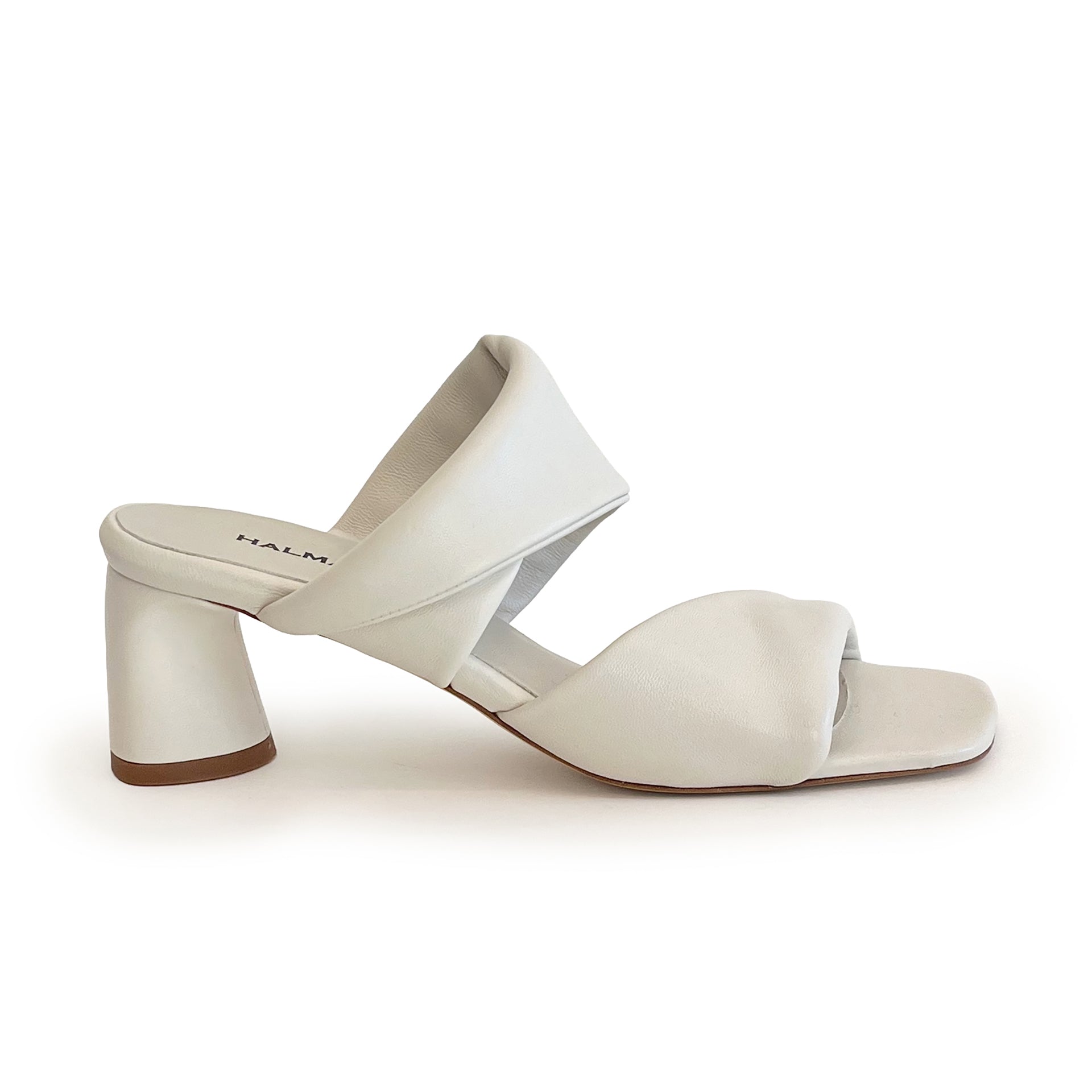 Ivory sculptured chunky heel sandal on a white background