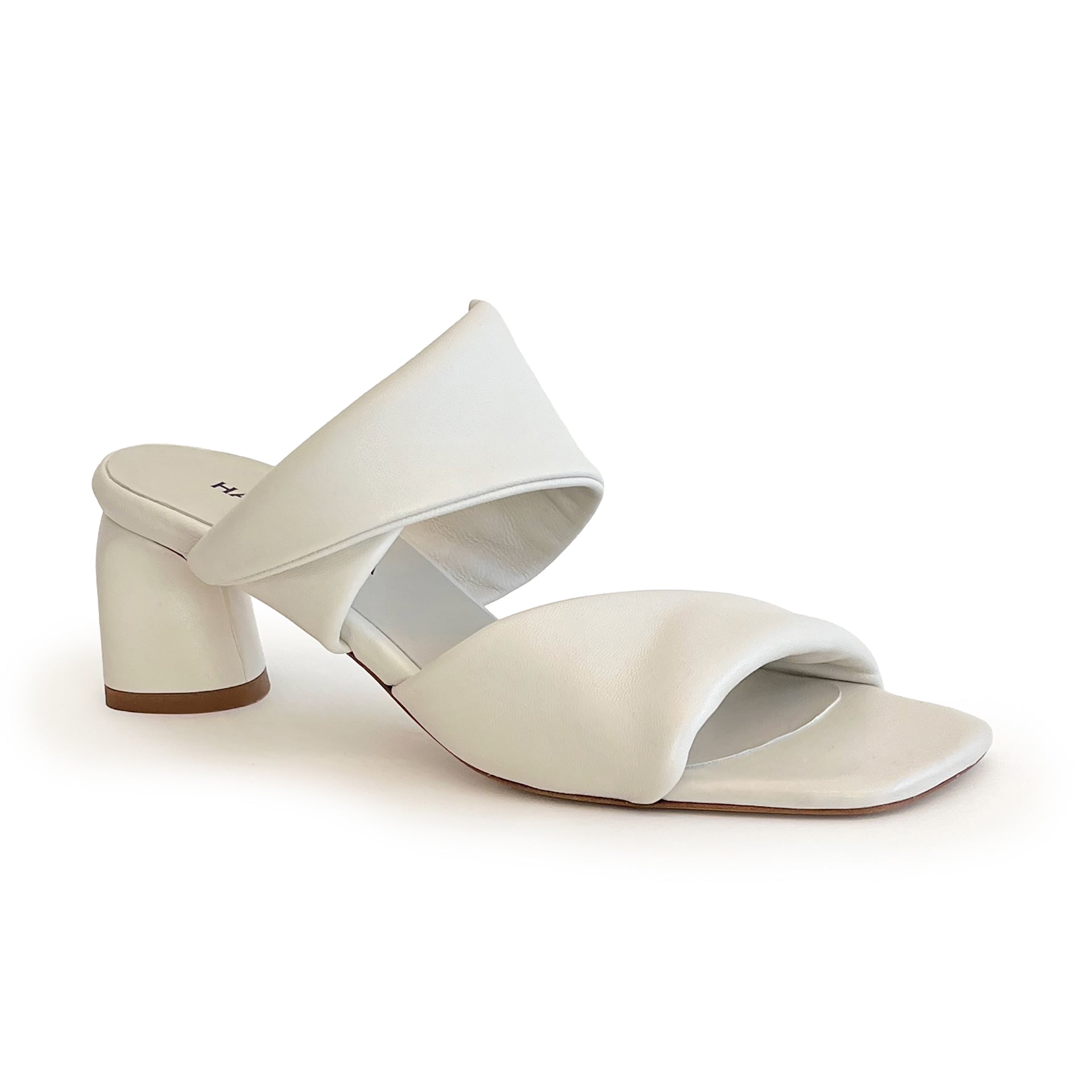 Ivory sculptured chunky heel sandal on a white background