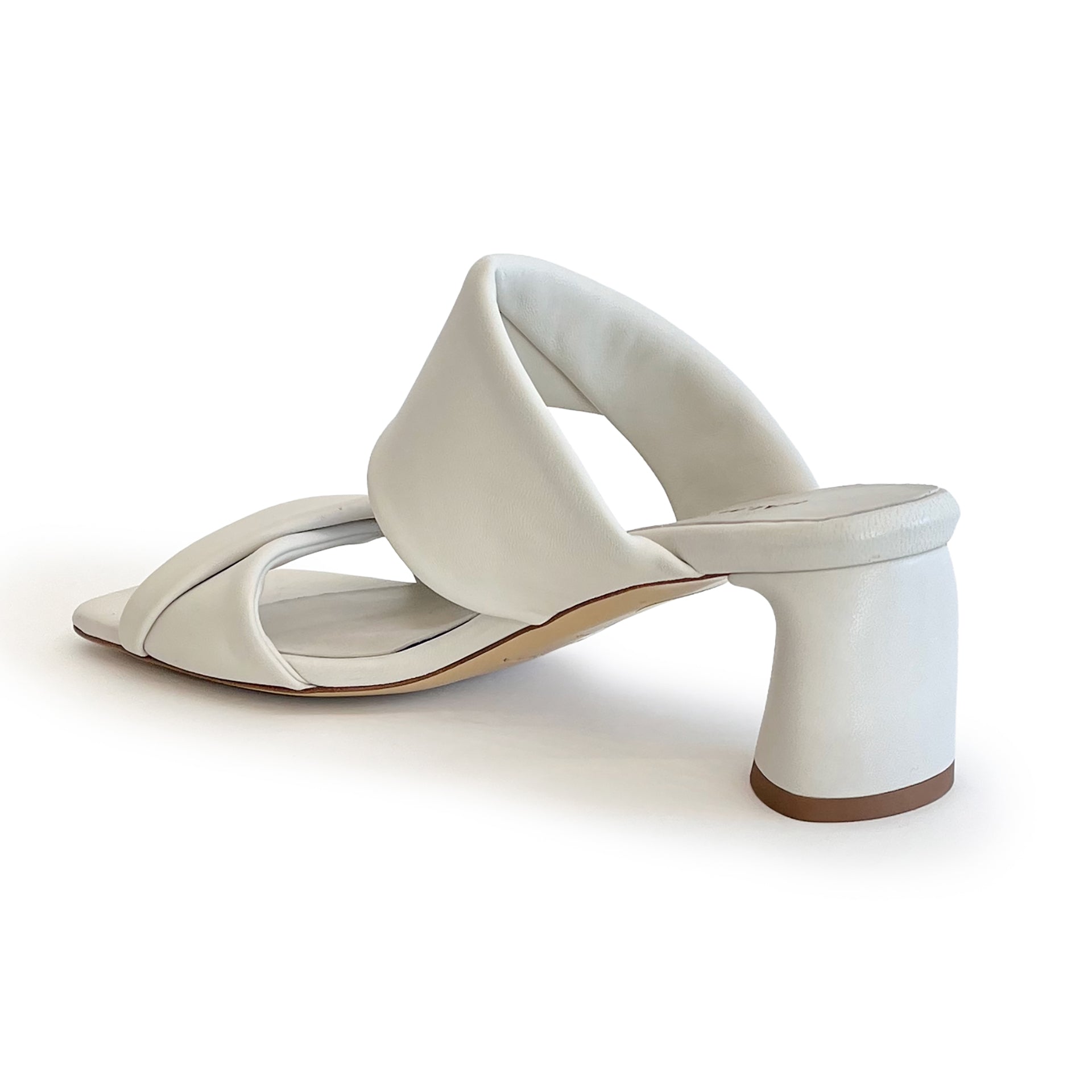 Ivory sculptured chunky heel sandal on a white background