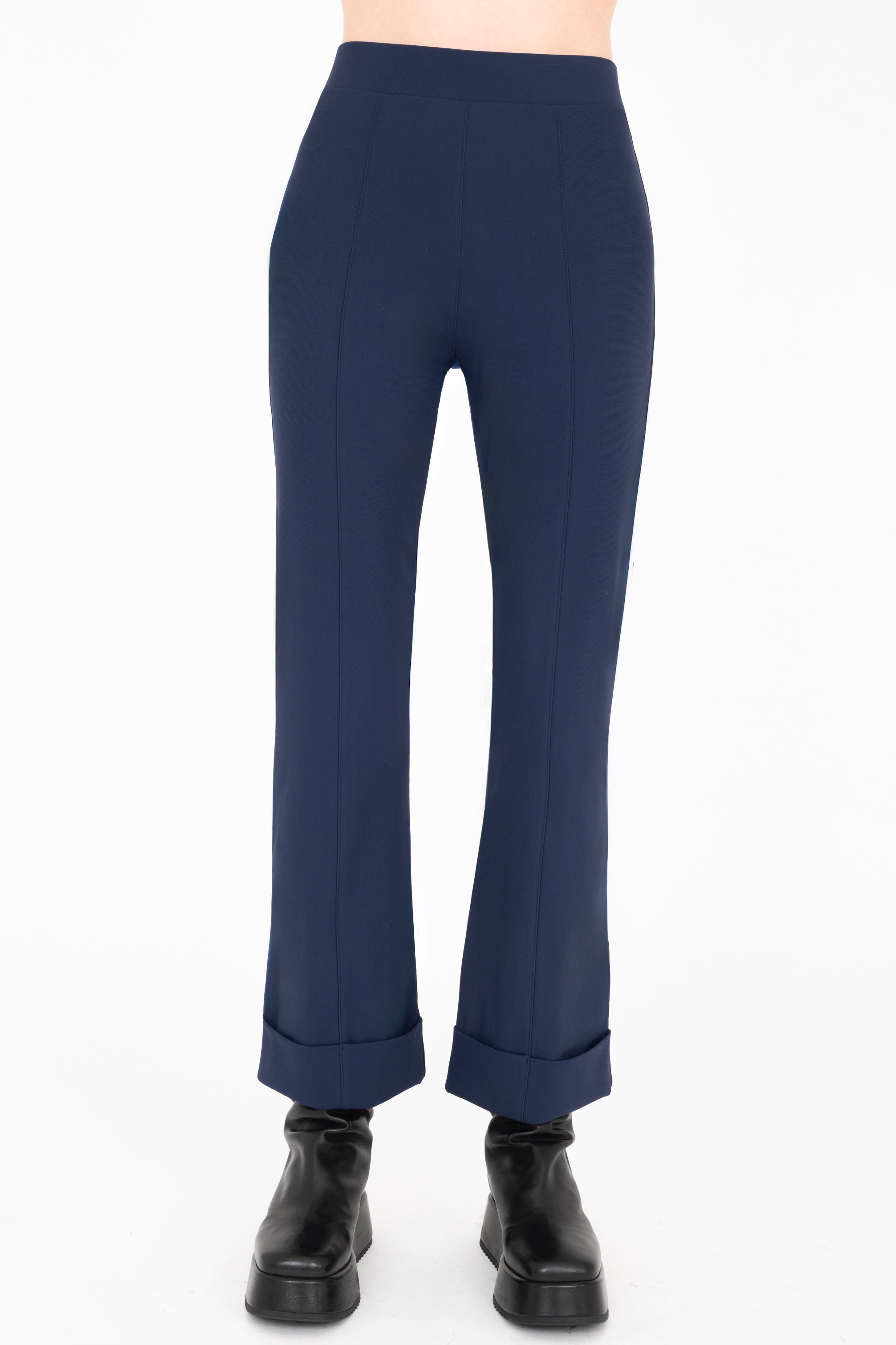 Navy blue pants worn by a person on a white background