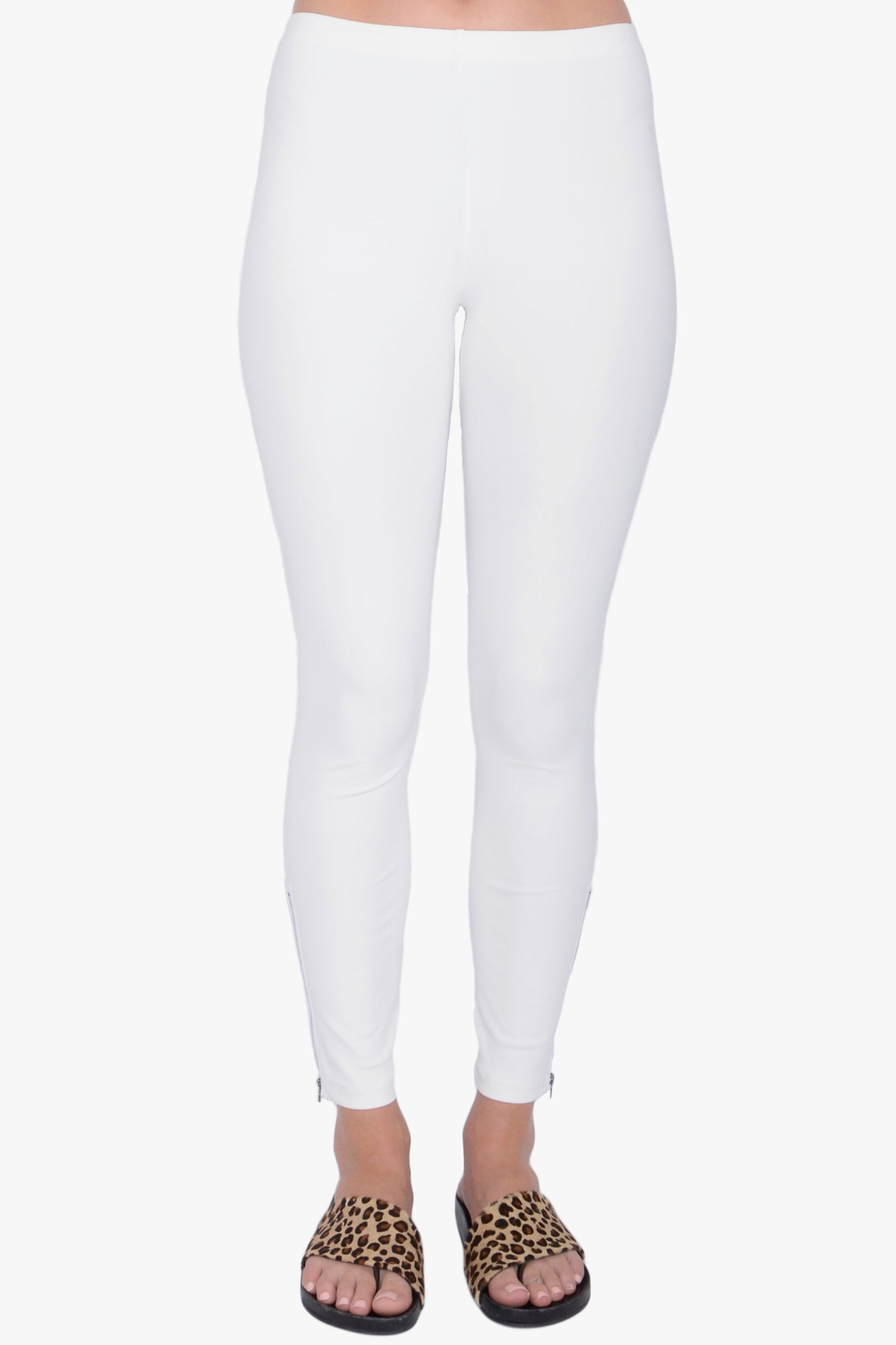 White leggings worn by a person on a white background