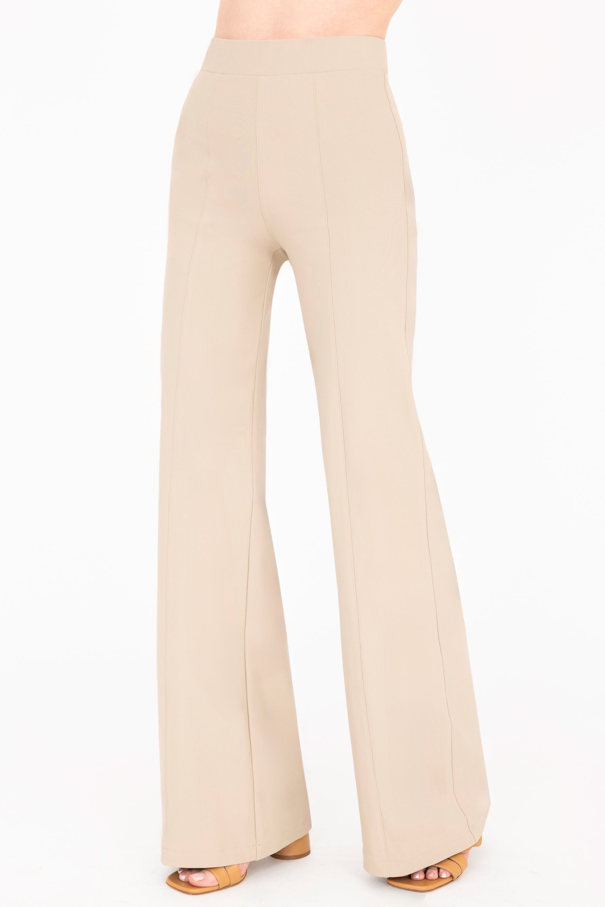 Quarter view of khaki wide-leg pants on a white background