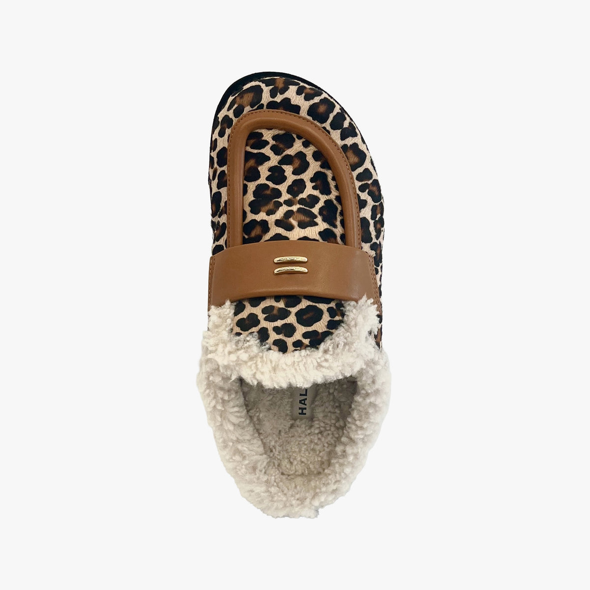 A single slip-on loafer-style shoe with a leopard print upper, tan leather strap, and fluffy cream sherpa lining, shown from a top-down view on a light gray background.