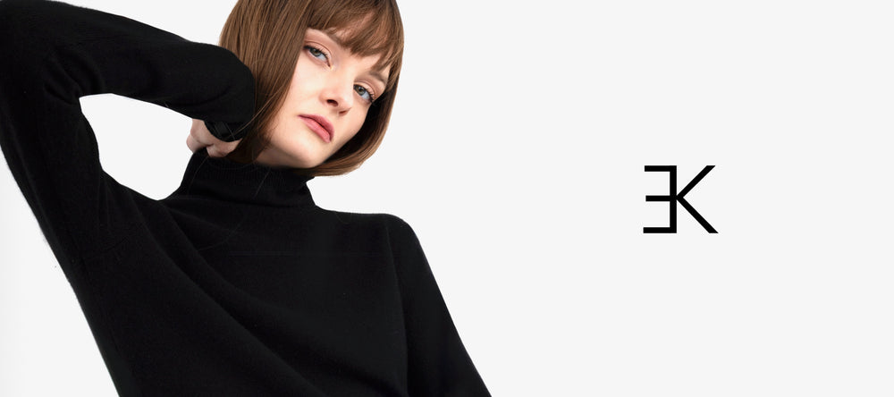 Person wearing a black turtleneck with a elaine kim logo on a white background