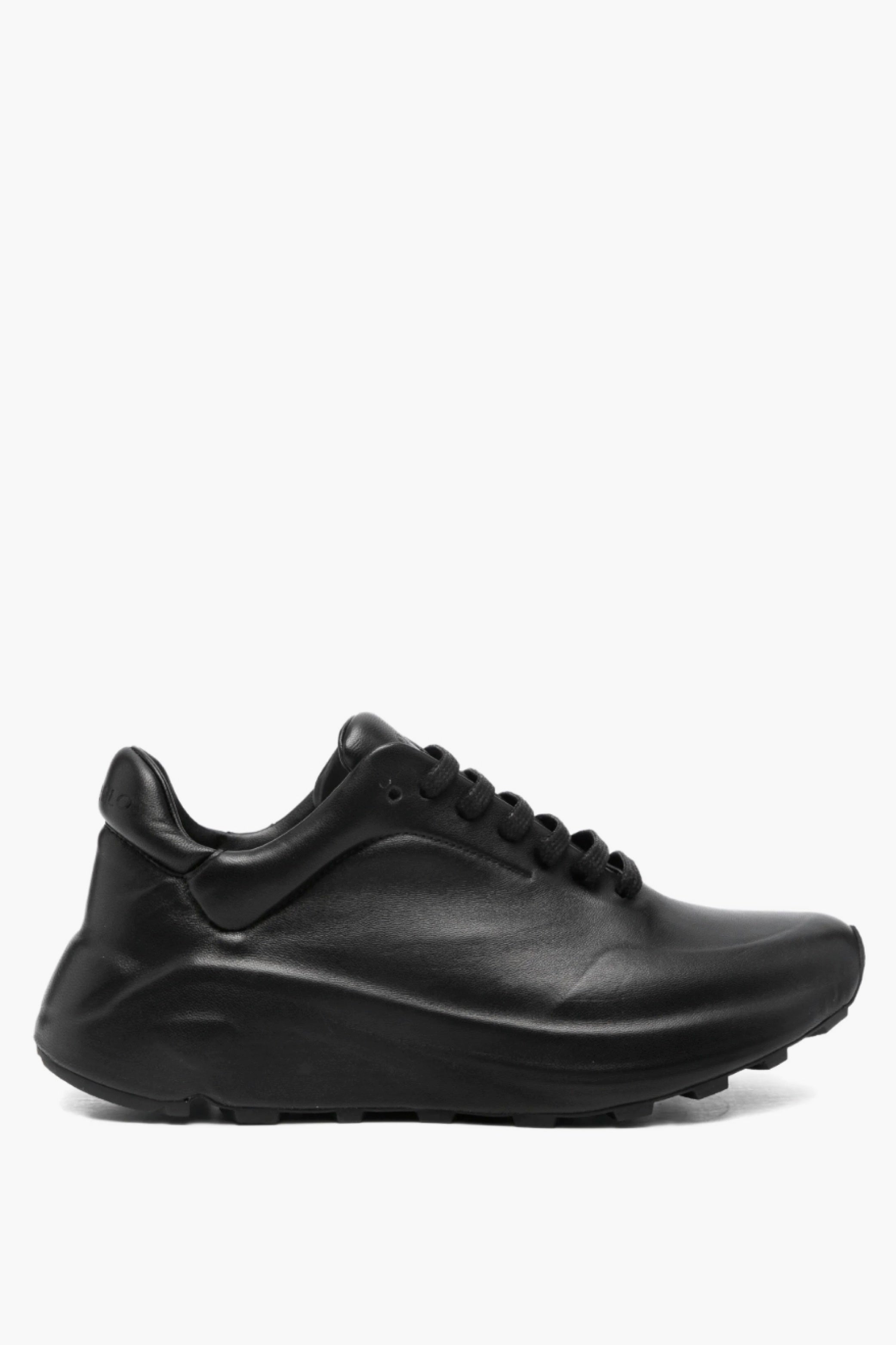 Black leather sneaker on a white background
