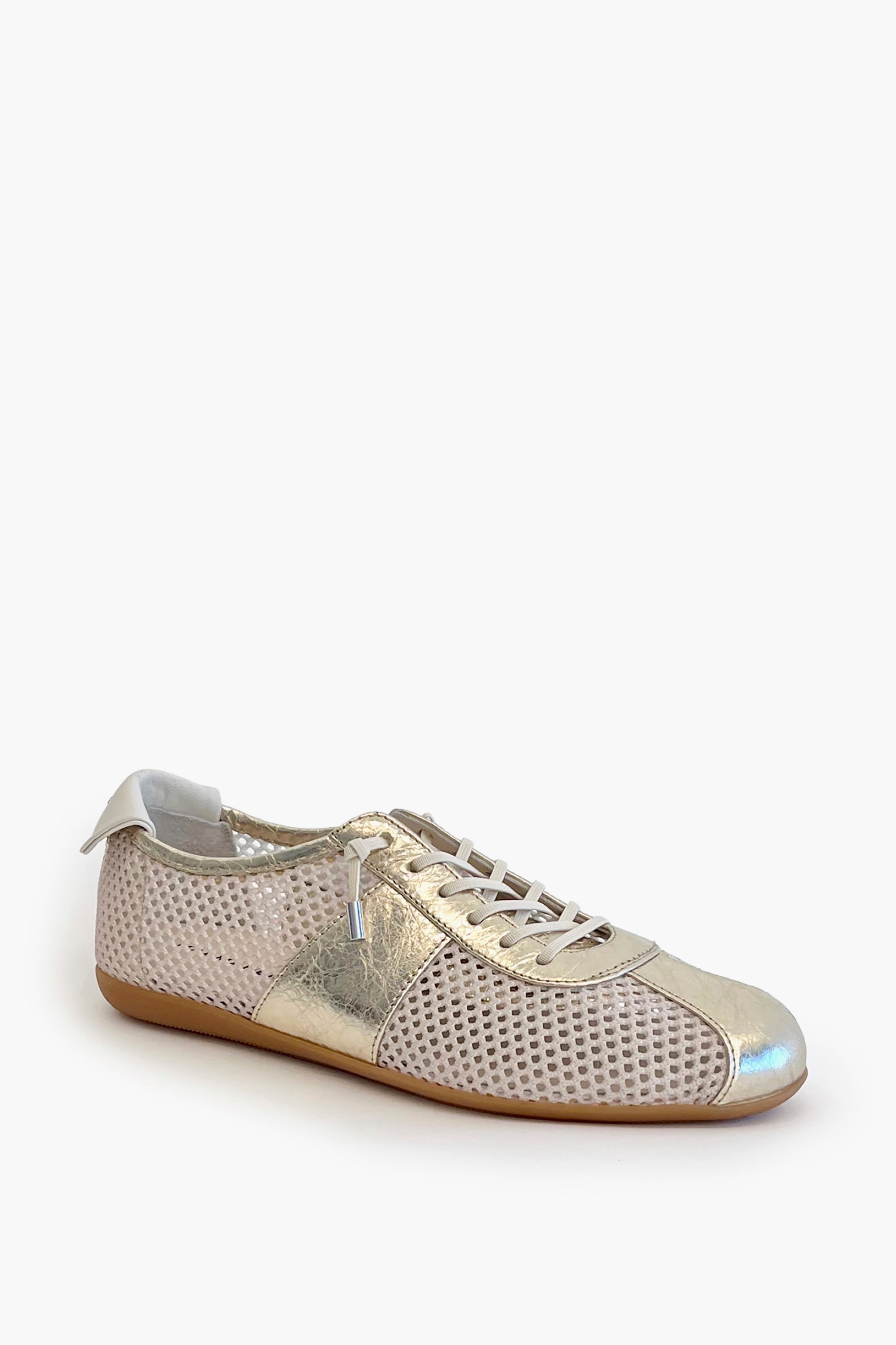 White mesh sneaker with metallic leather contrast on a white 
