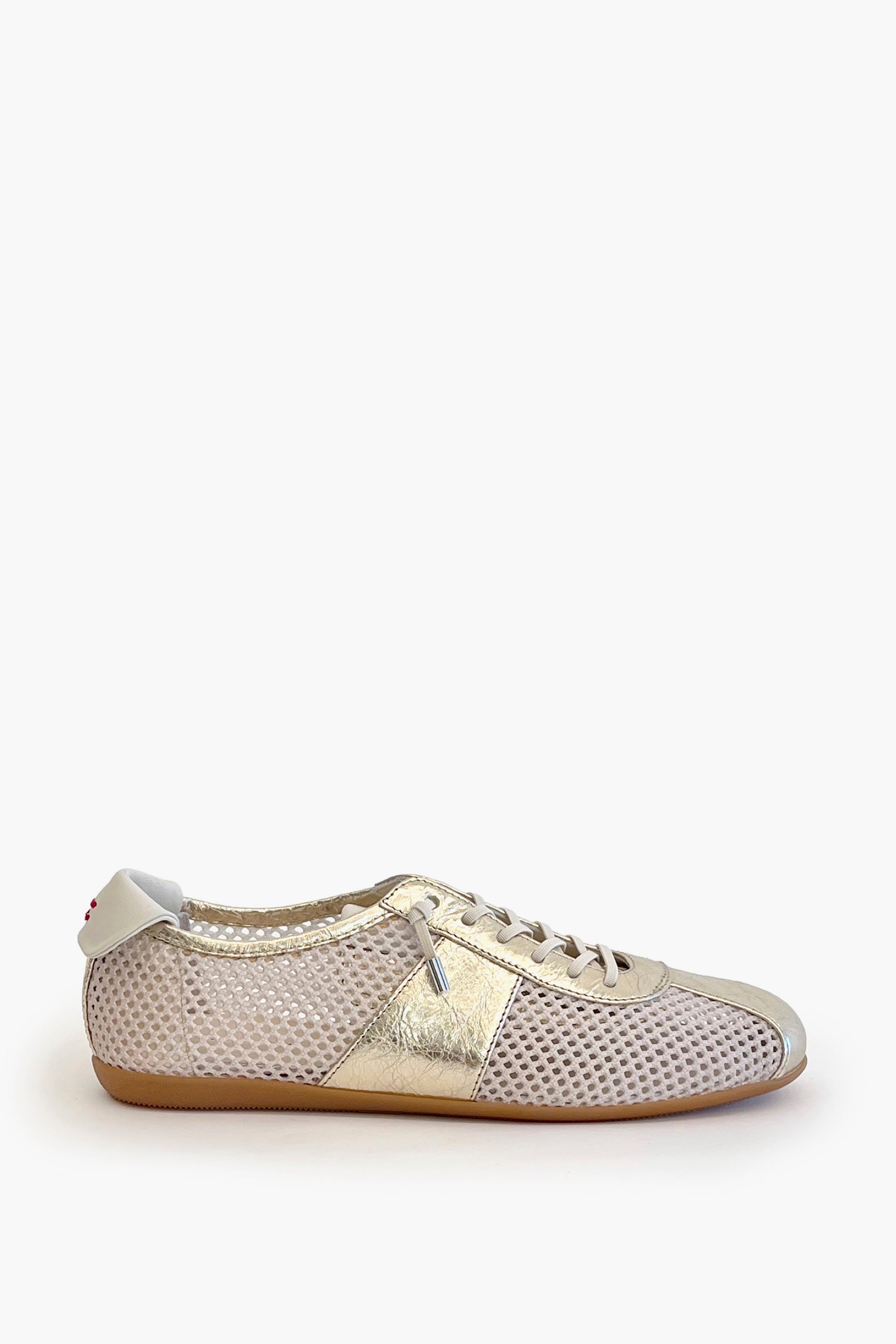 White mesh sneaker with metallic leather contrast on a white 