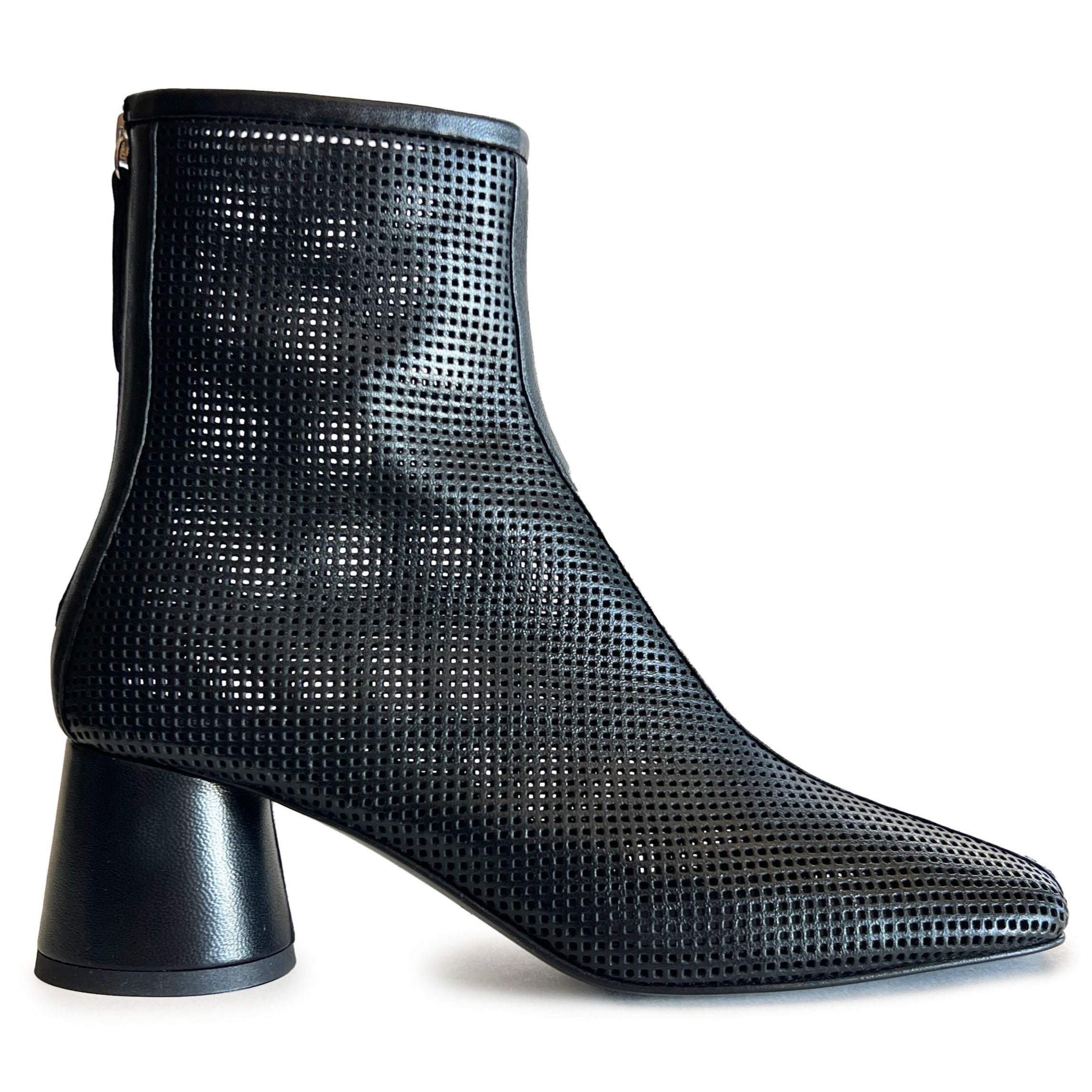 Black round toe perforated ankle boot on a white background