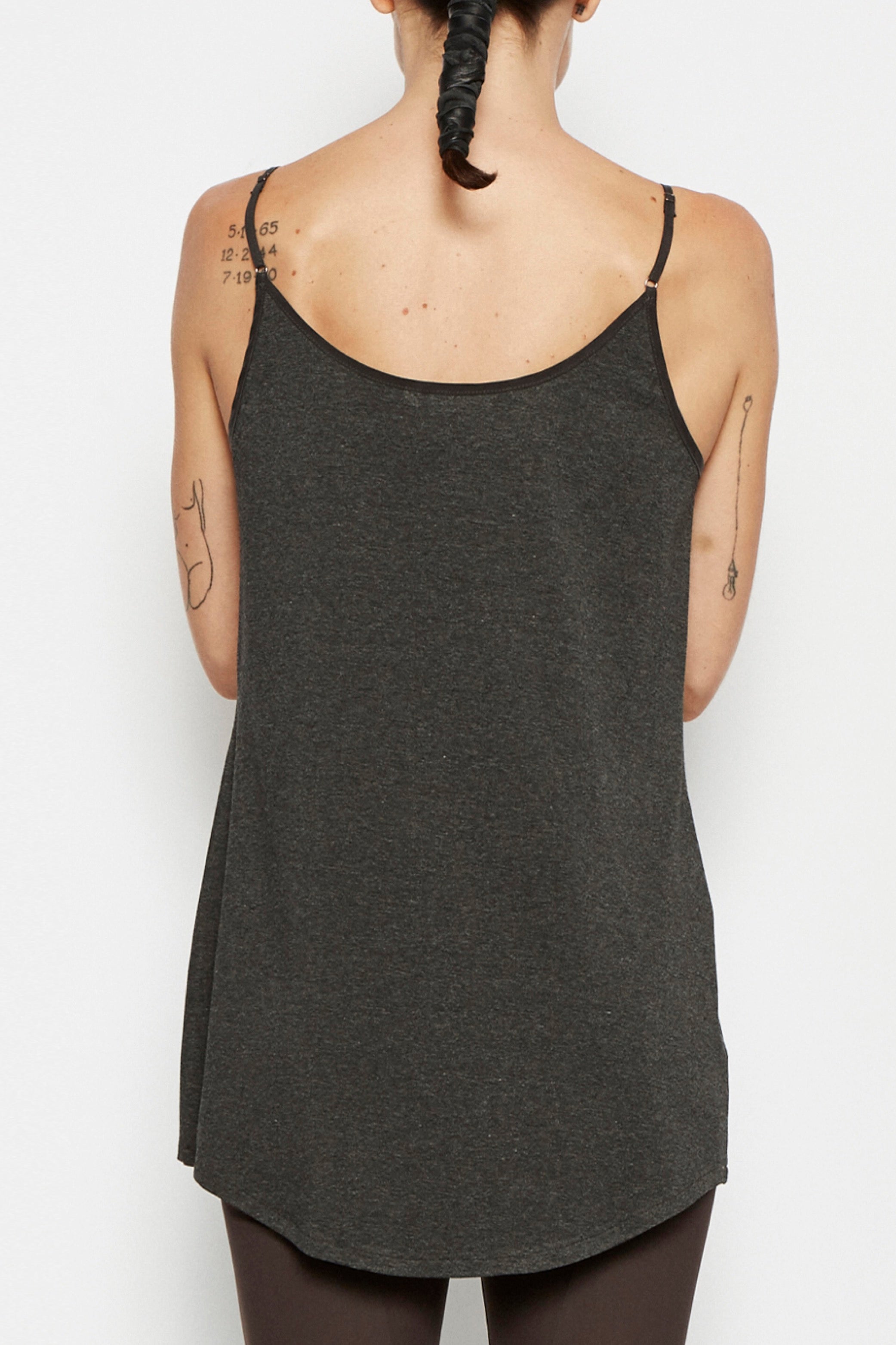 Dark gray camisole worn on a white background