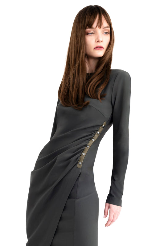 Woman wearing a green dress on a white background