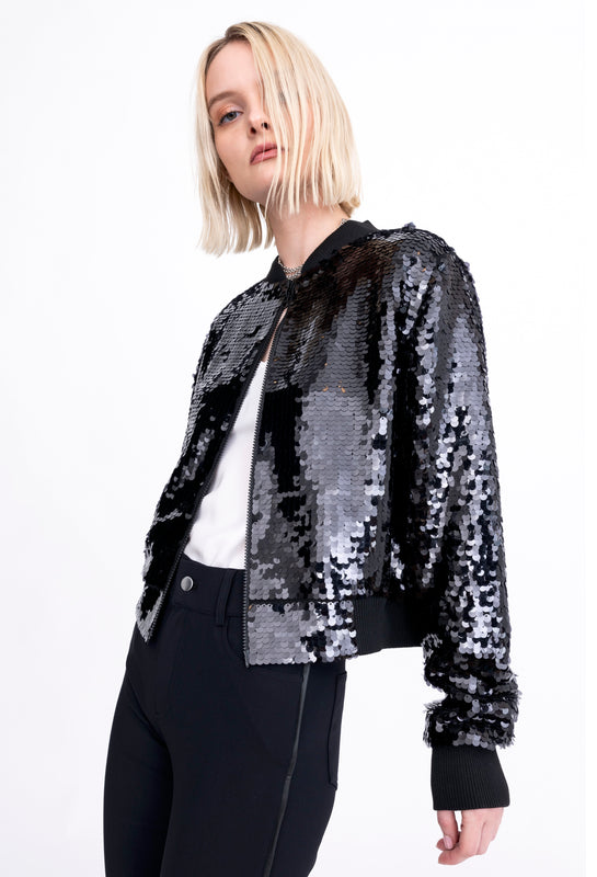 woman wearing sequin jacket