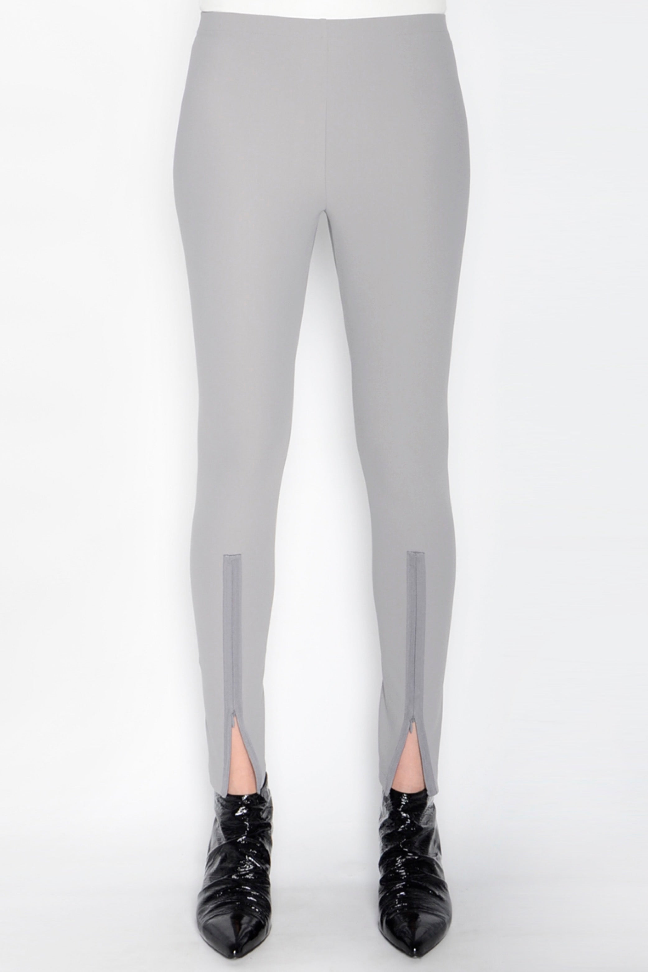 Gray leggings with front slits on a white background