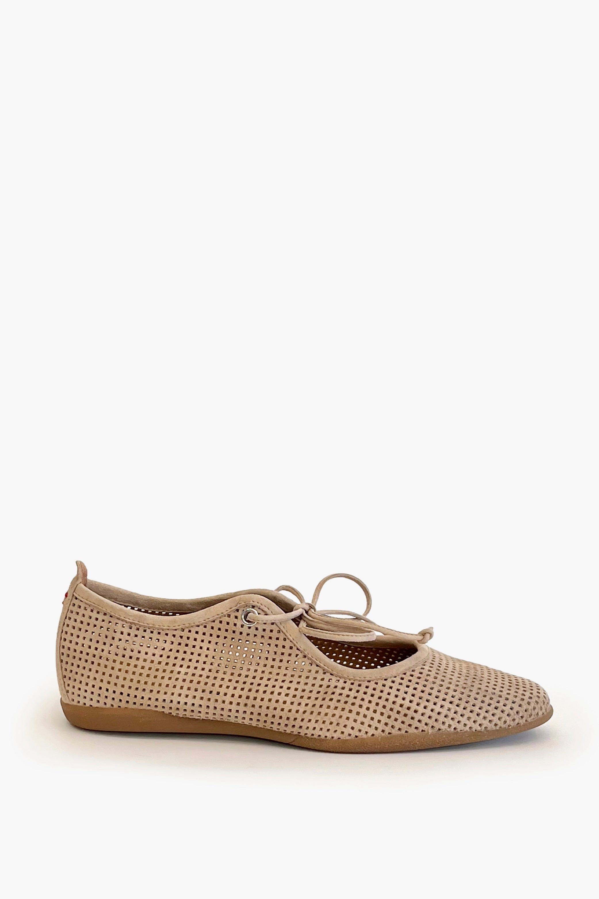 Beige perforated suede ballet flat shoe on a white background