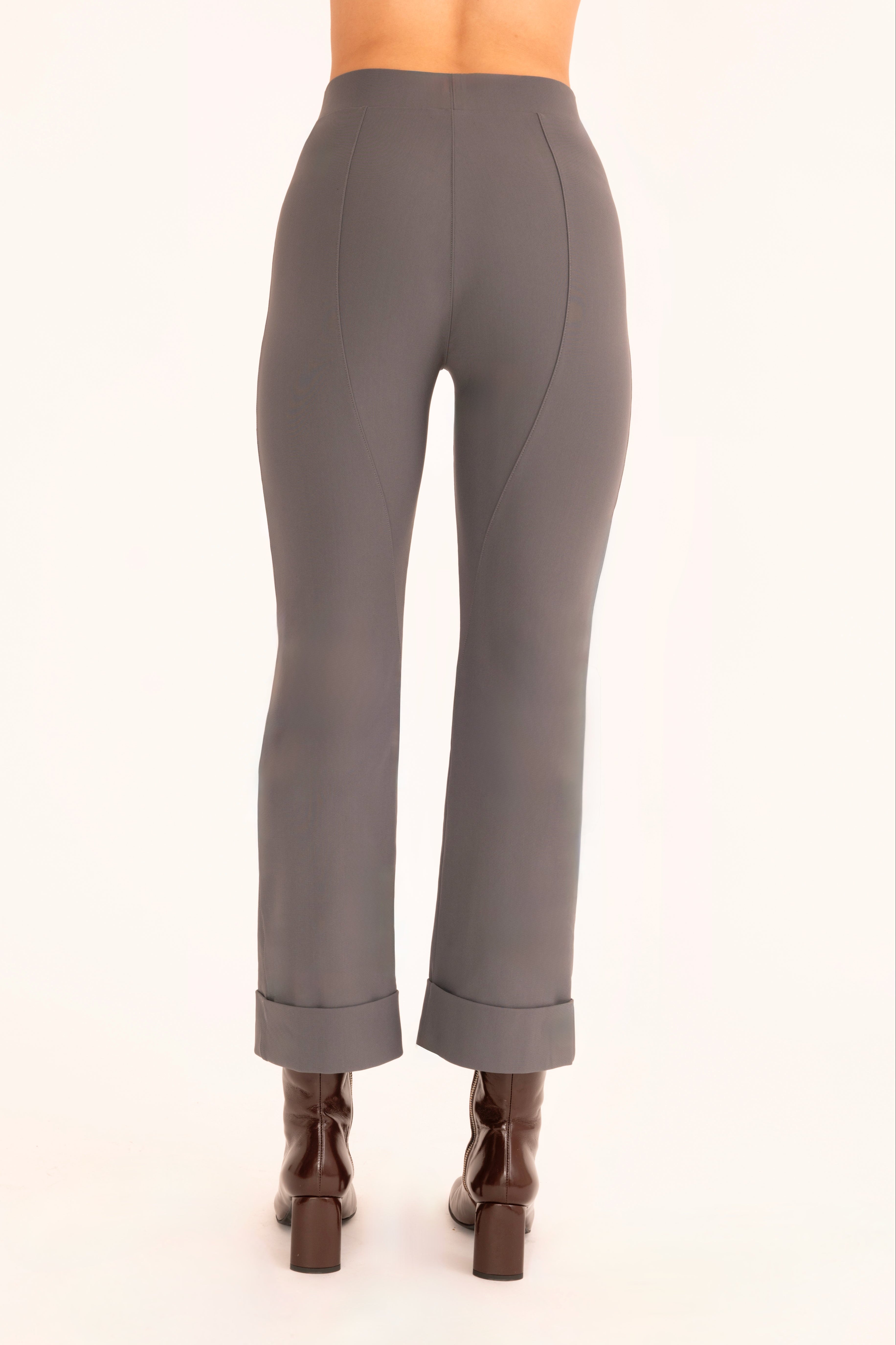 Back view of gray cropped cuff pants on a white background