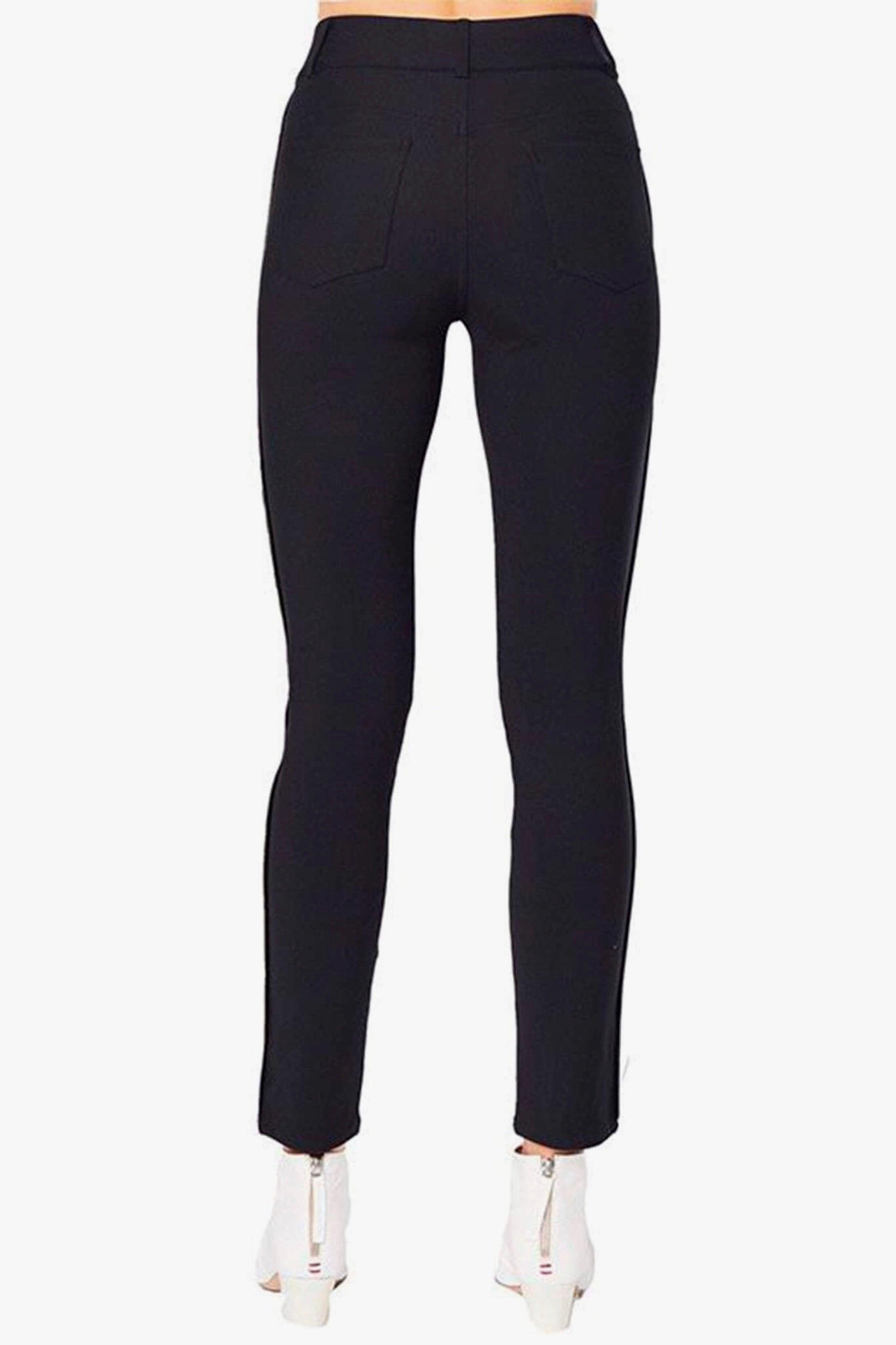 Black pants worn by a person on a white background