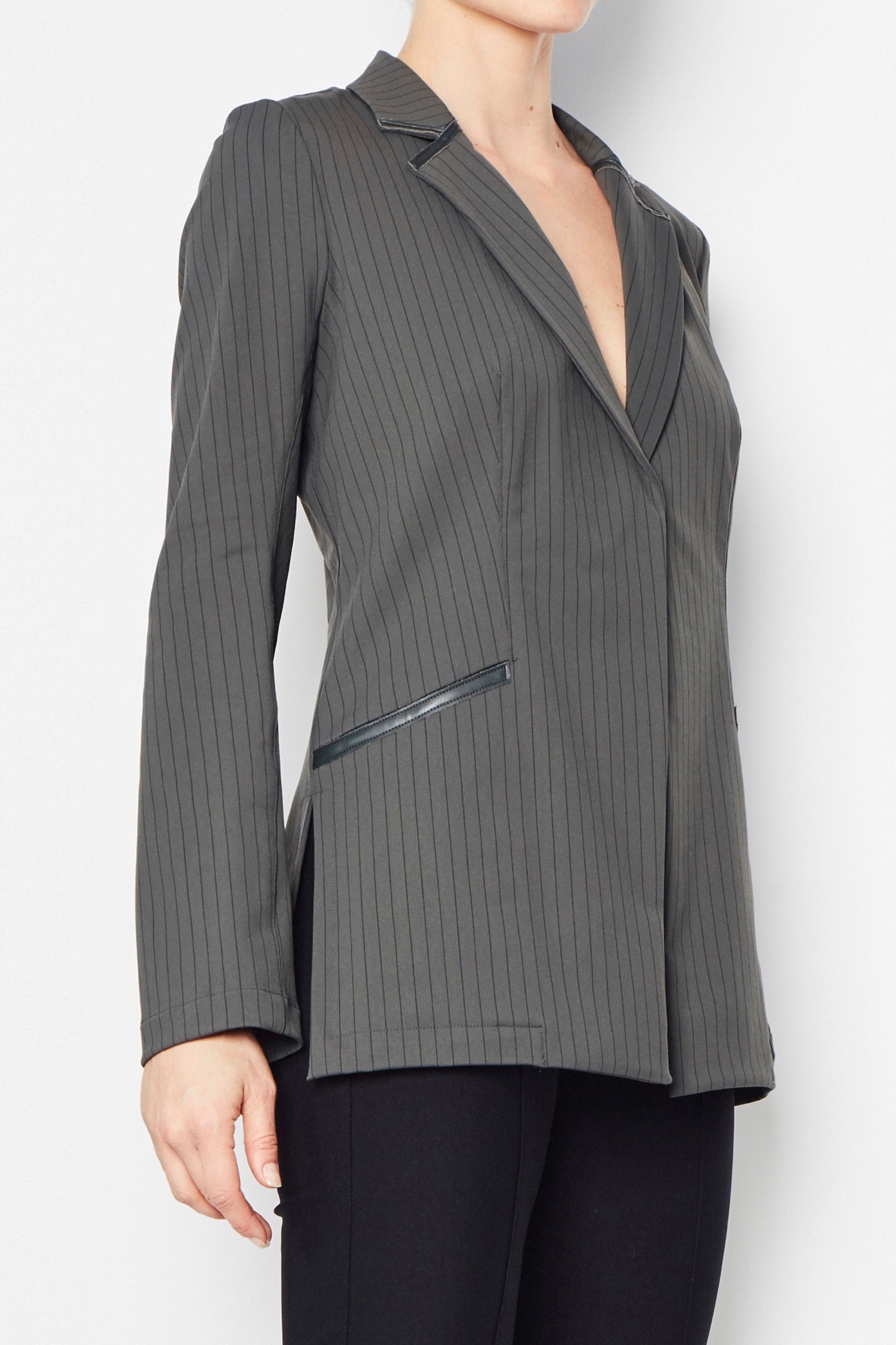 Gray pinstripe blazer worn on a white background