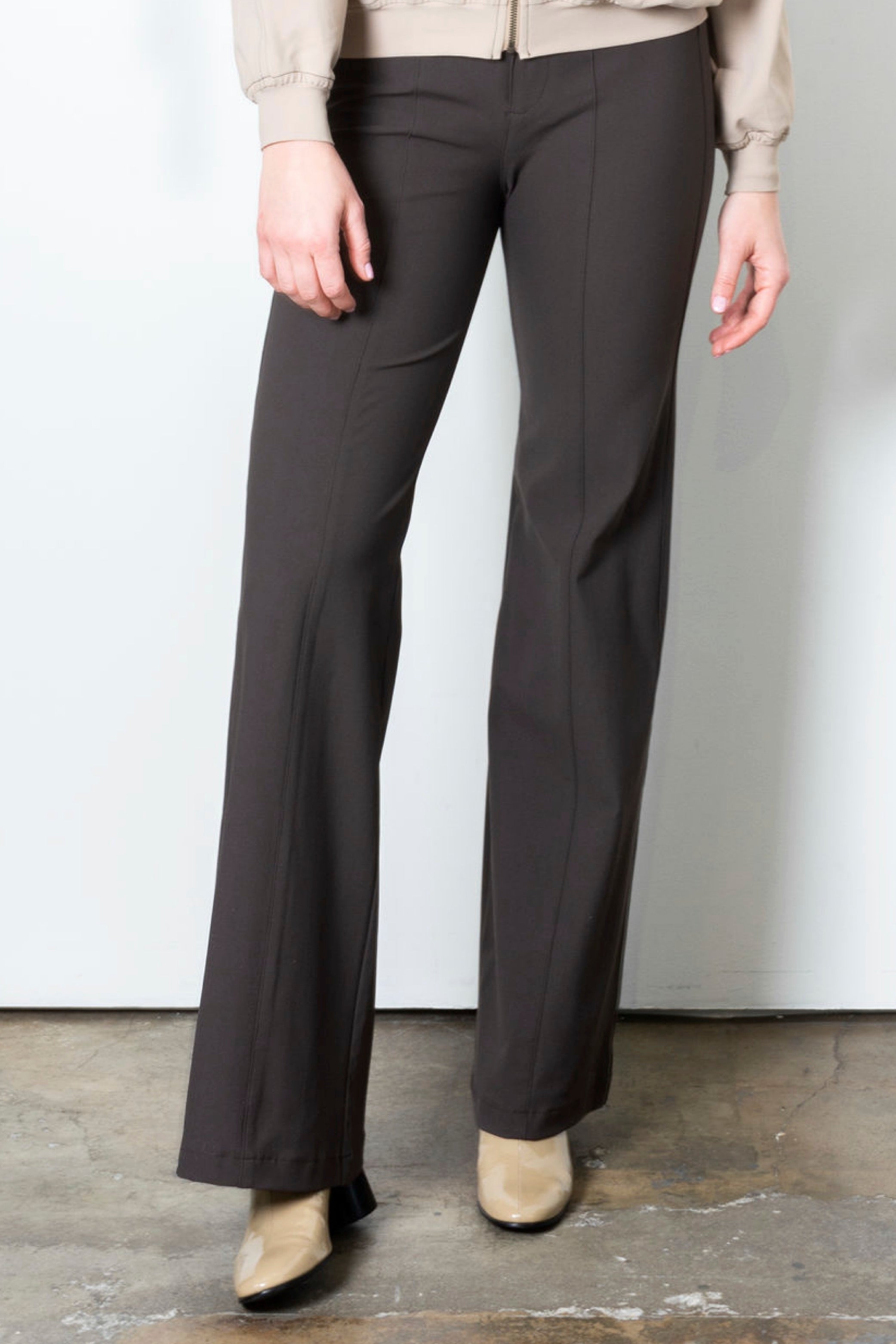 Brown wide leg pants on a plain background