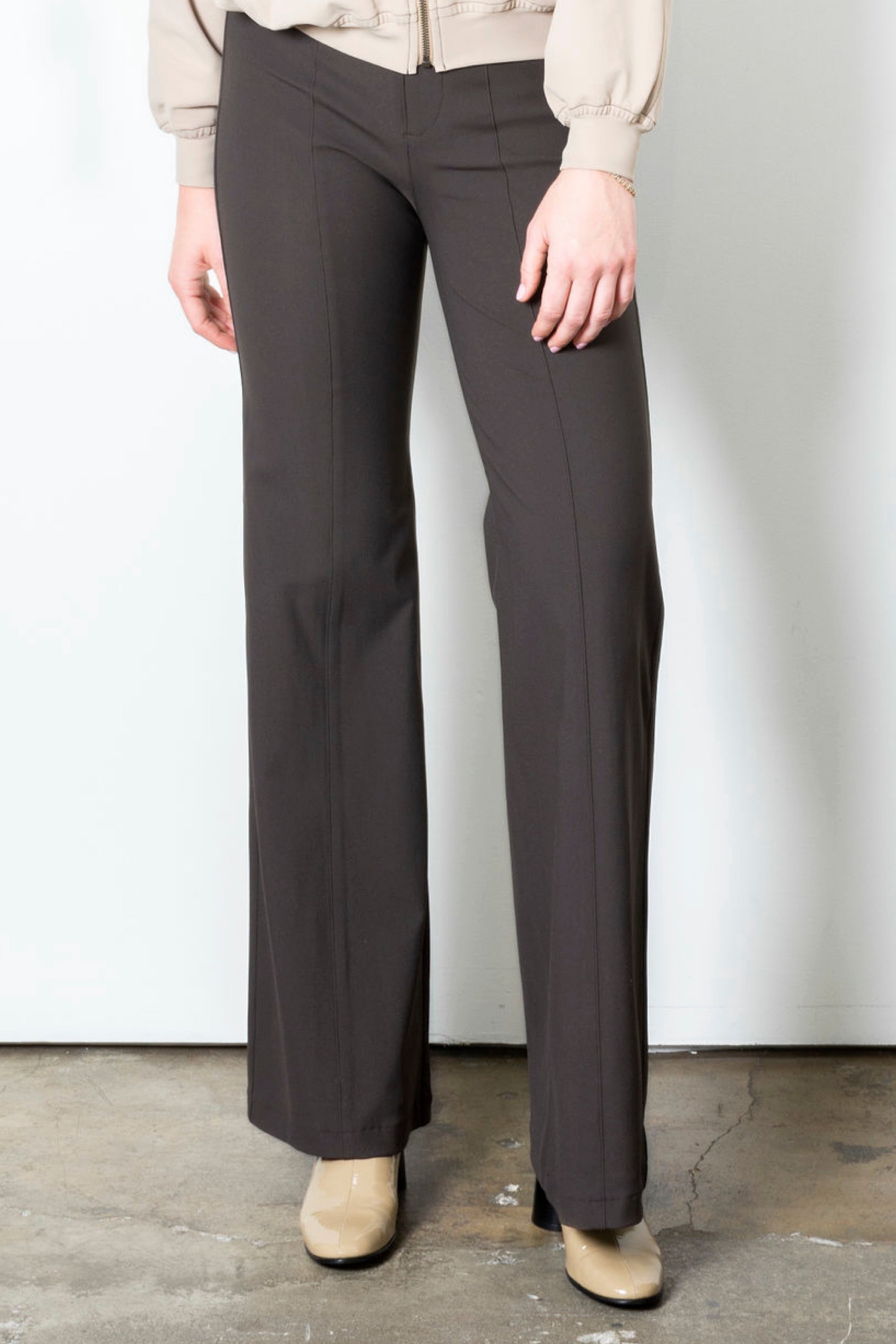 Brown wide leg pants on a plain background