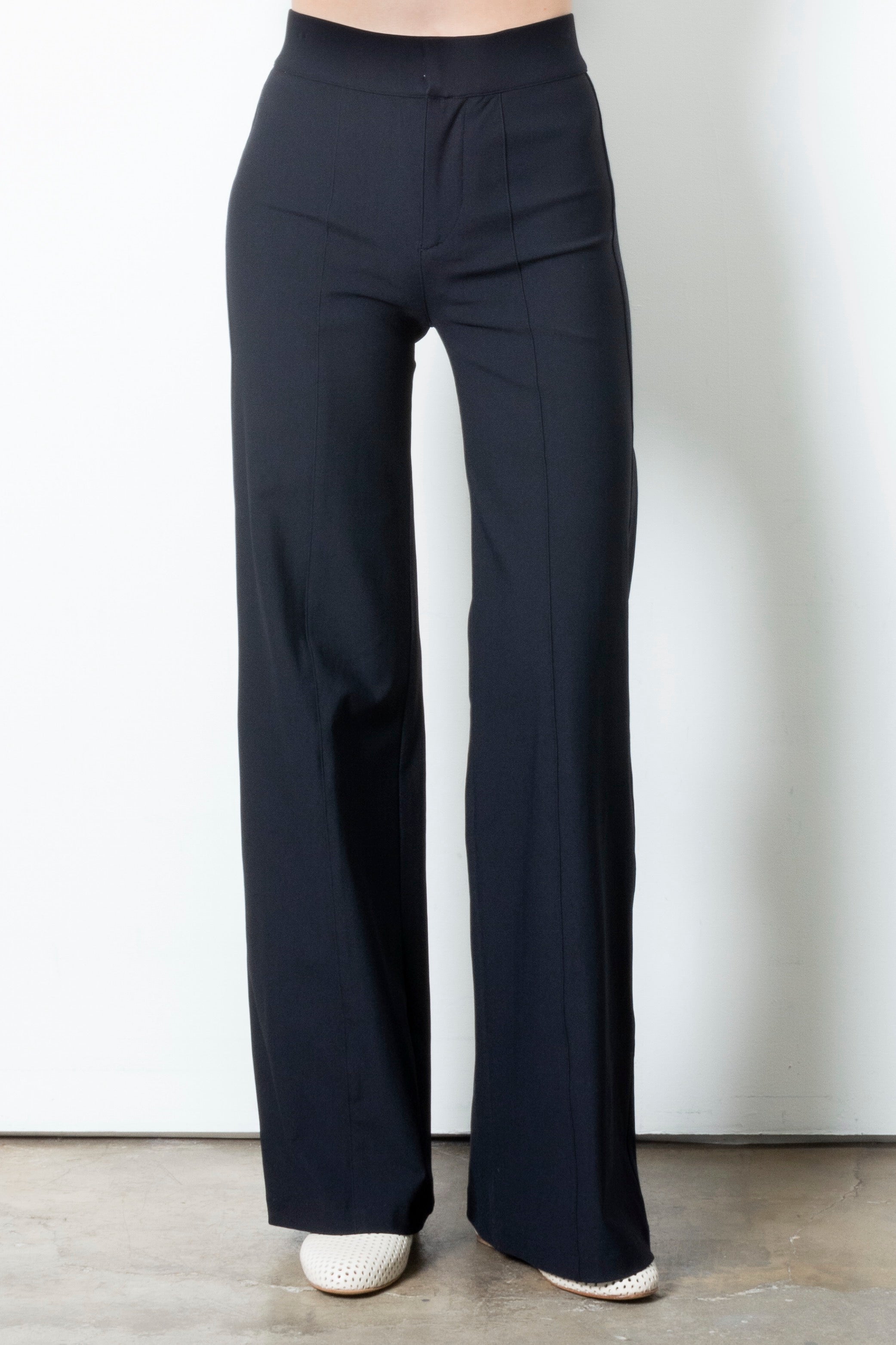 Black wide-leg pants on a plain background