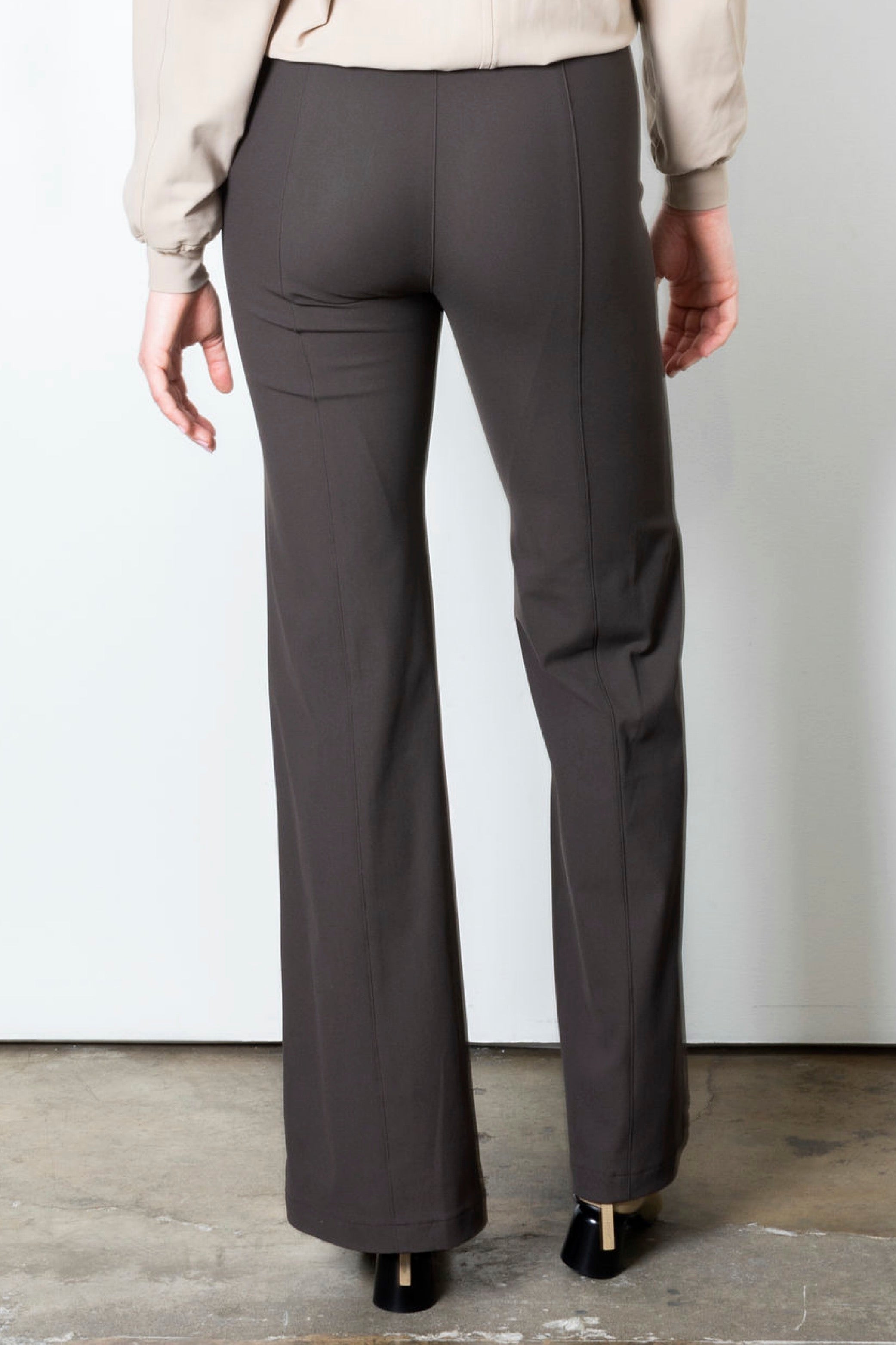 Brown wide leg pants on a plain background