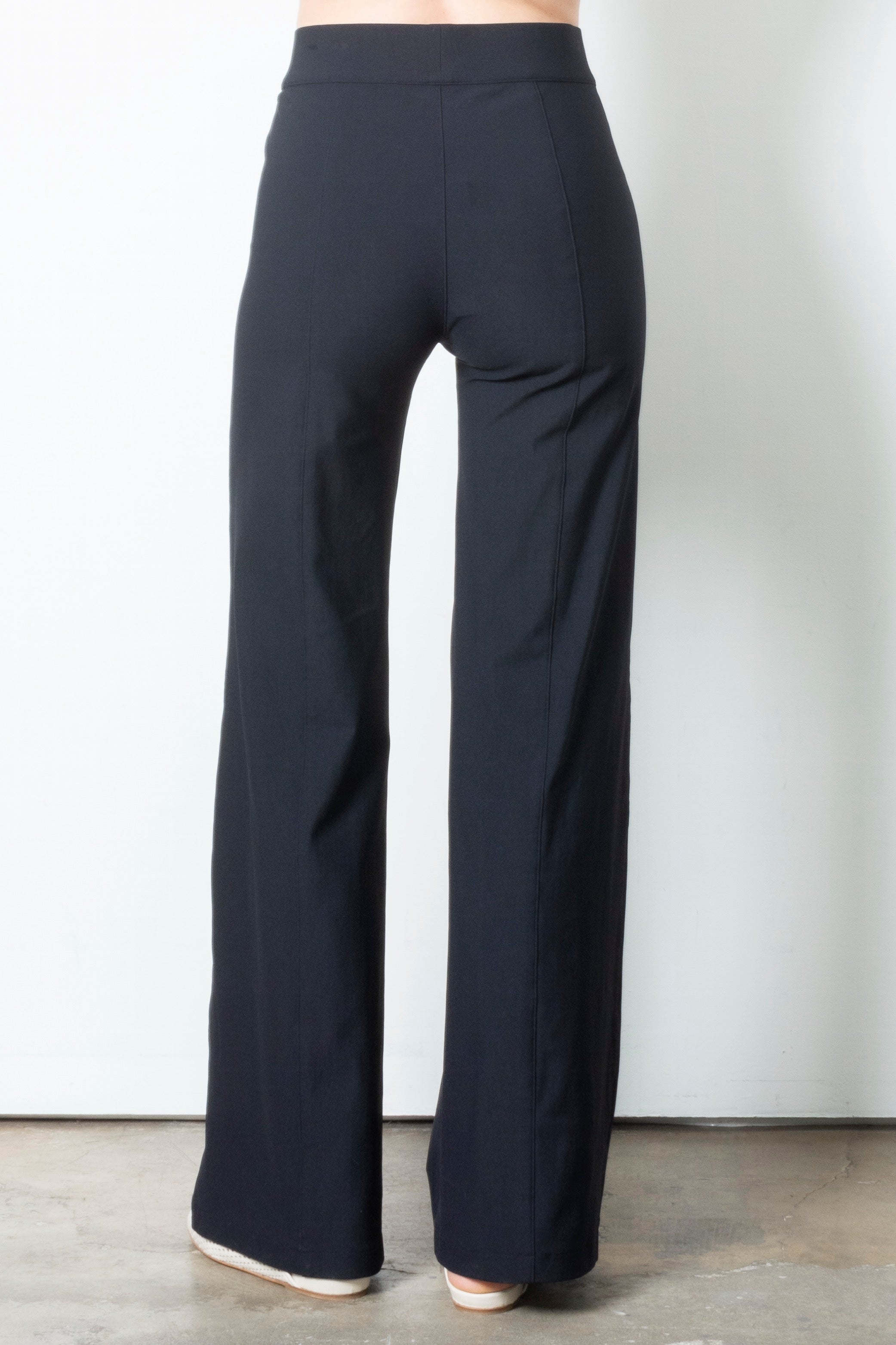 Black wide-leg pants on a plain background