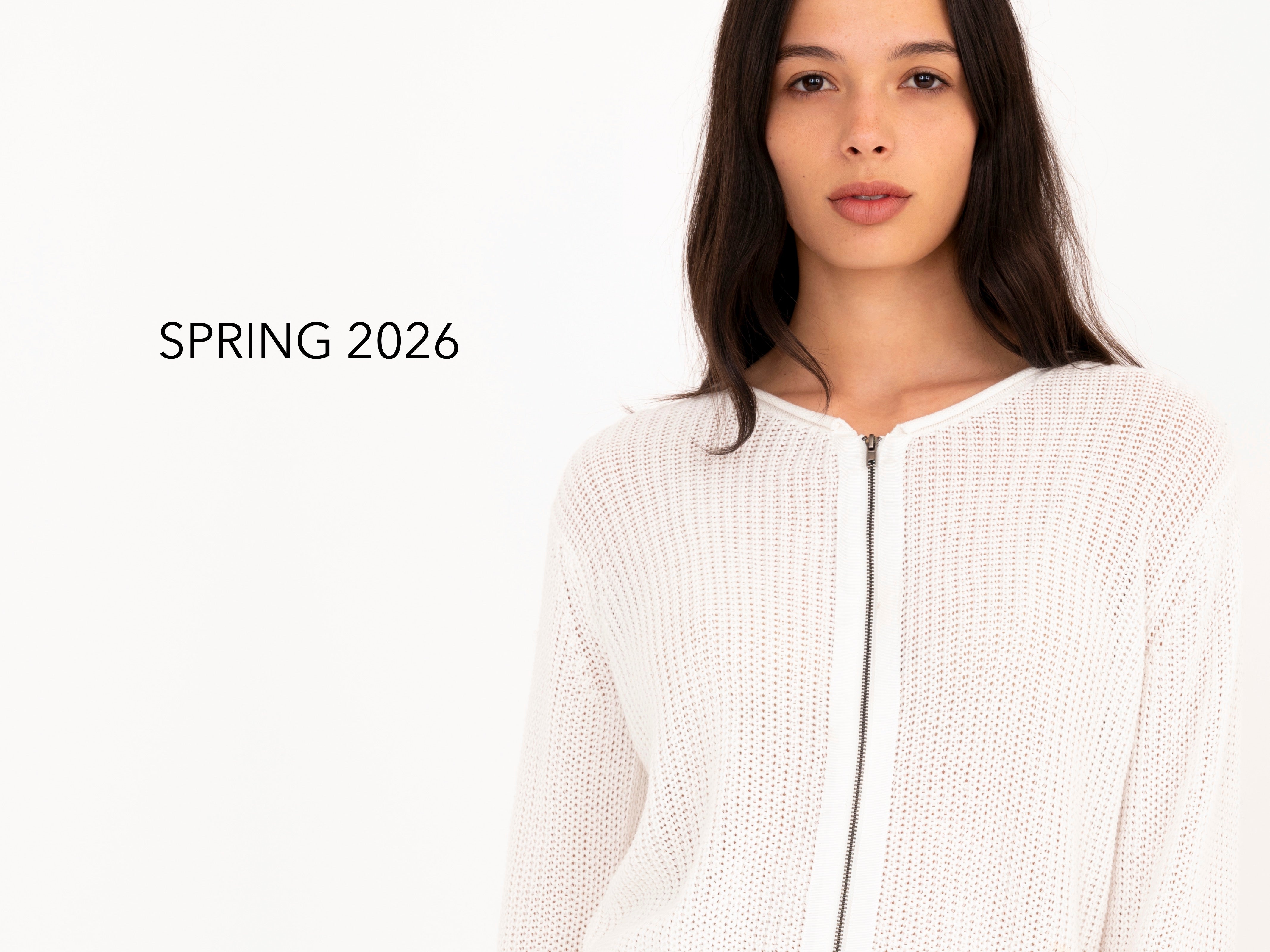 Woman wearing white sweater on a white background