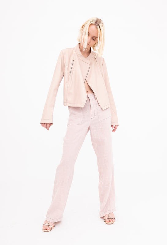 woman wearing blush pink linen moto jacket and pants