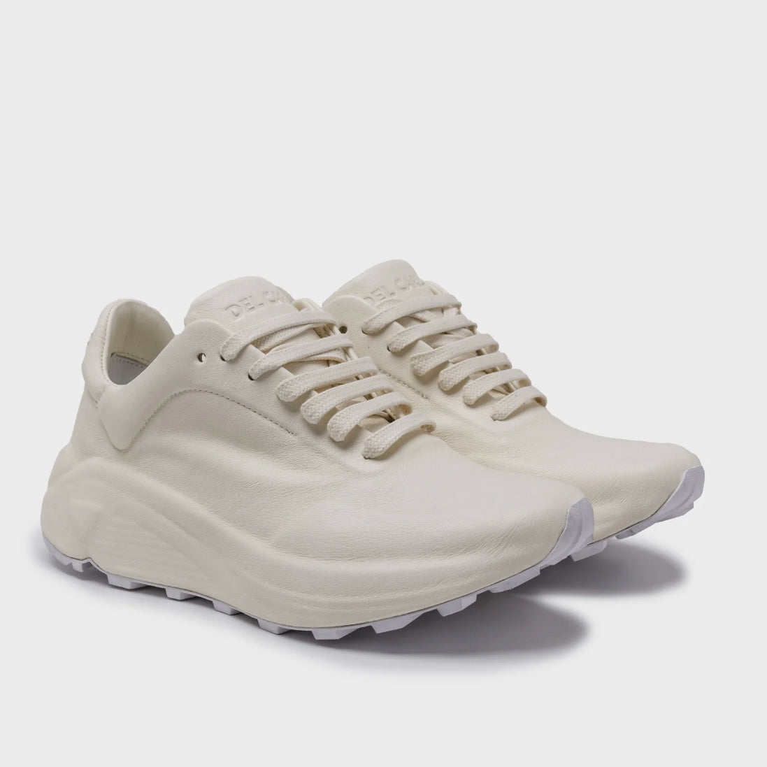 White sneaker on a light gray background